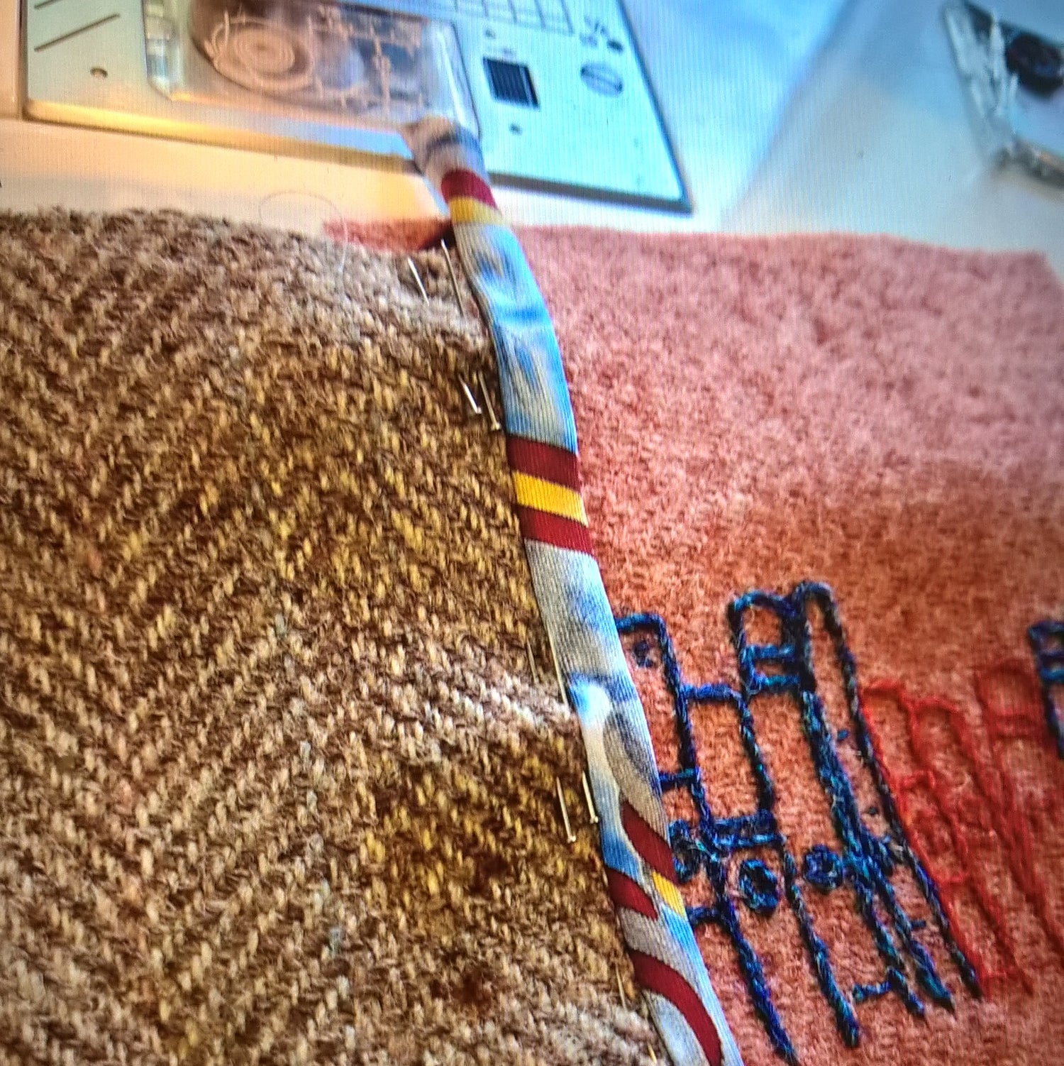Joining hand embroidered and plain Harris Tweed together with colourful silk trim