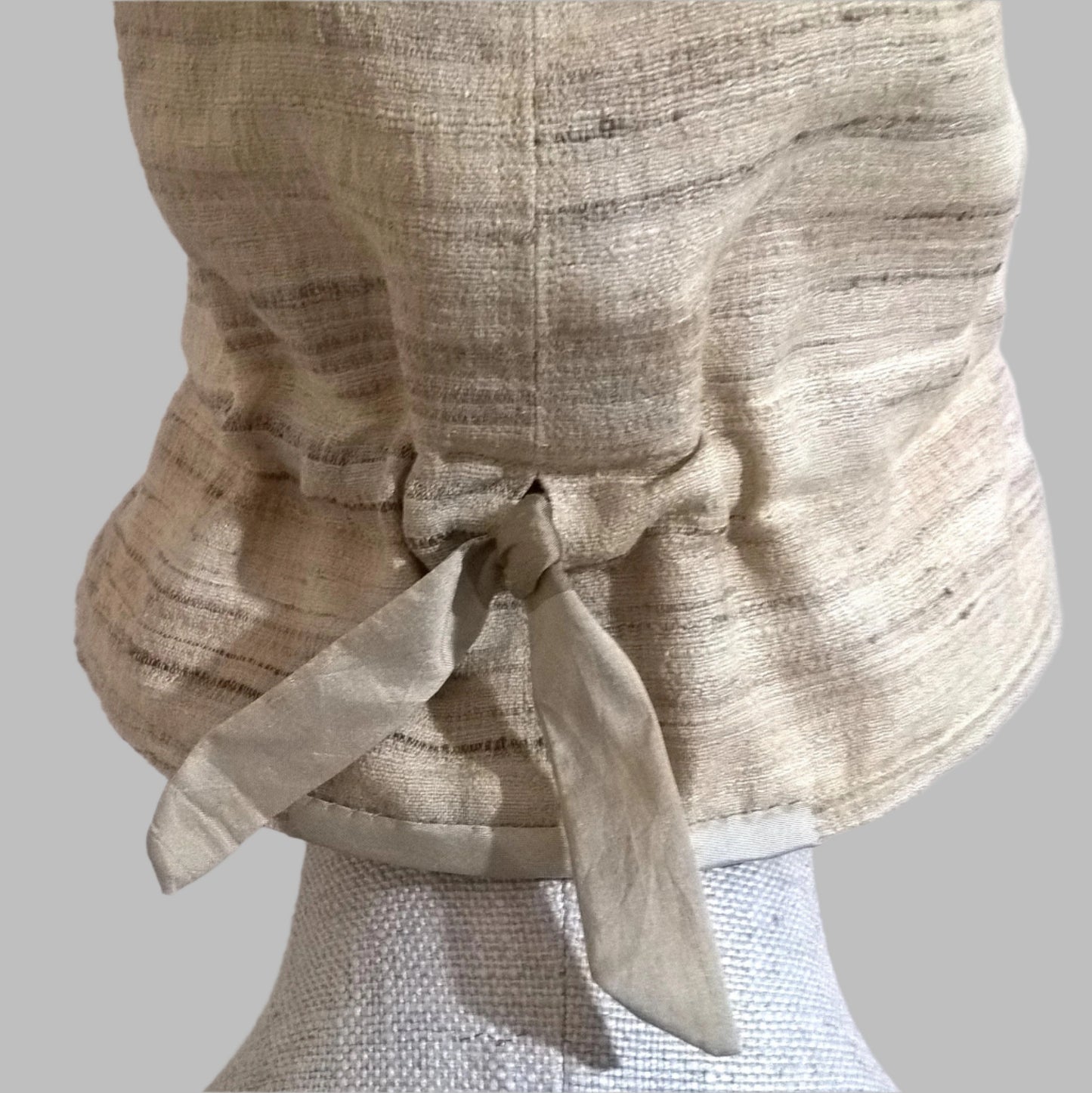 Adjustable tie ribbon at back of silk bucket hat