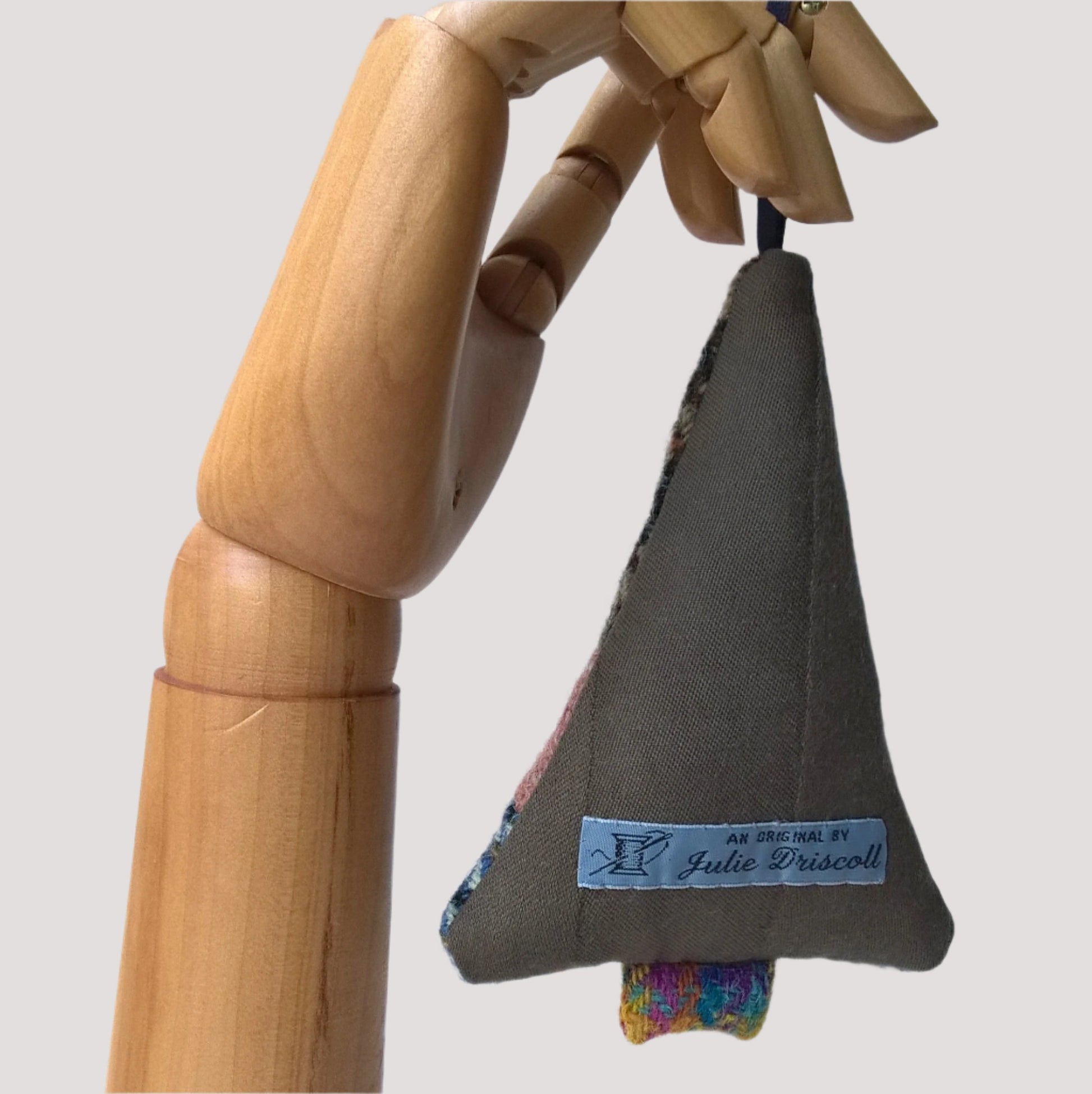 Bak of tree ornament is brown wool