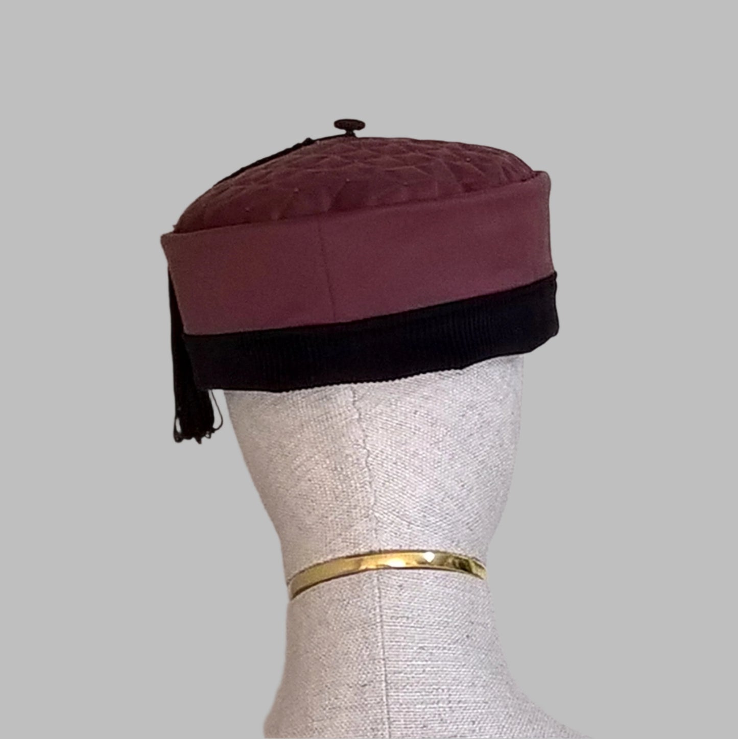 Back view of the maroon smoking cap