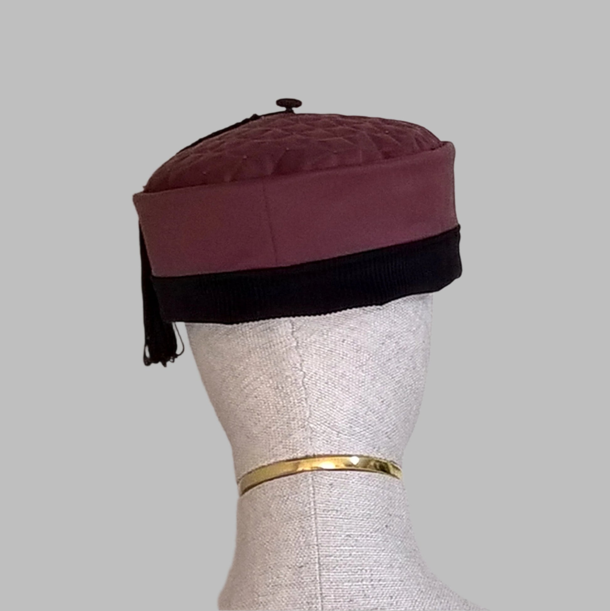 Back view of the maroon smoking cap