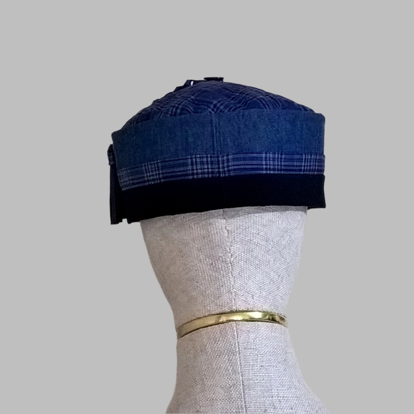 Back view of cobalt blue smoking cap trimmed with fine wool check