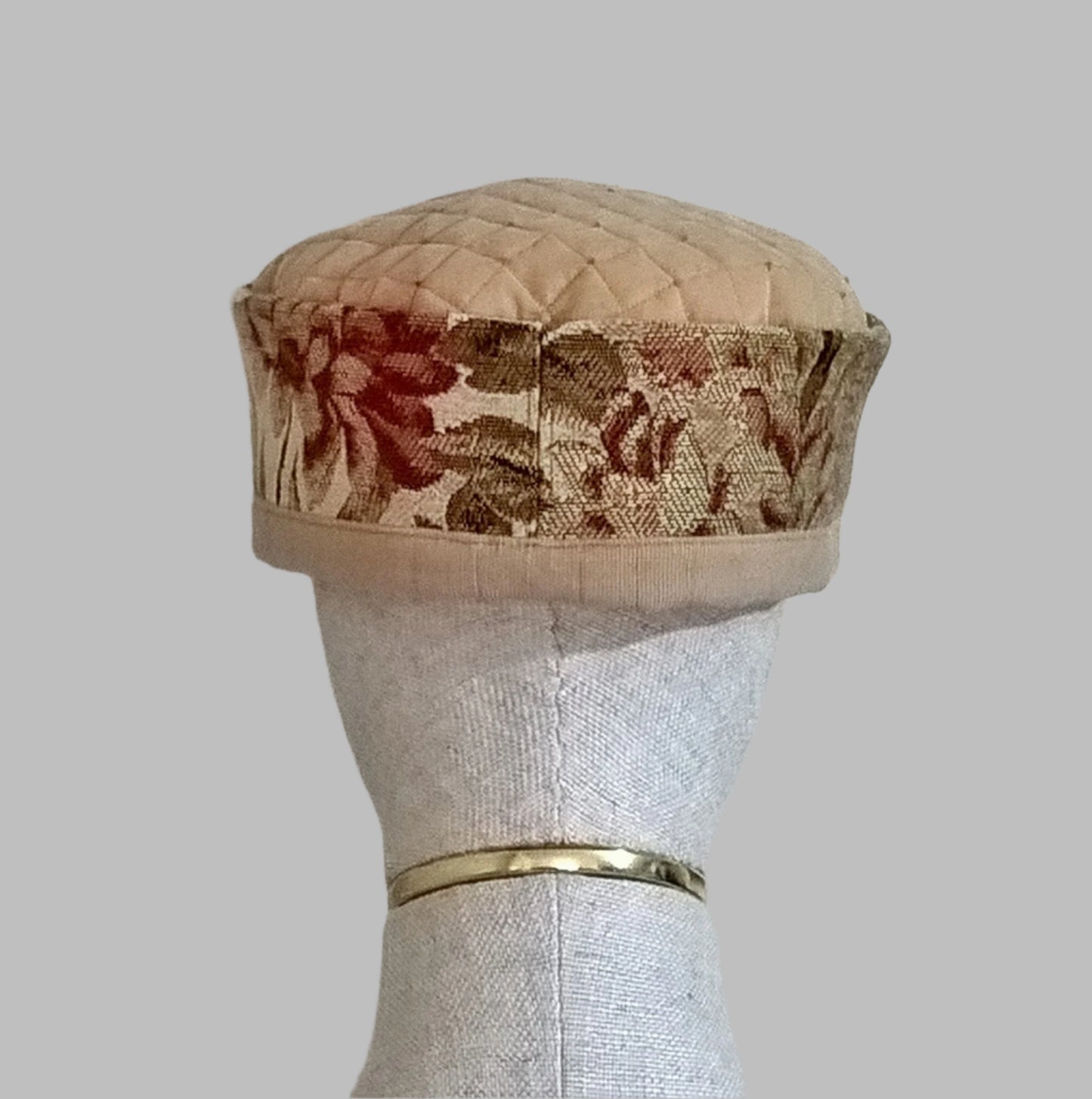 Back view of floral tapestry smoking cap
