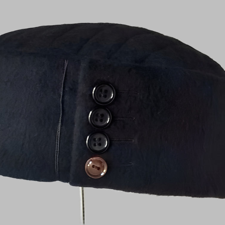 Button detail on crown of up-cycled cashmere hat