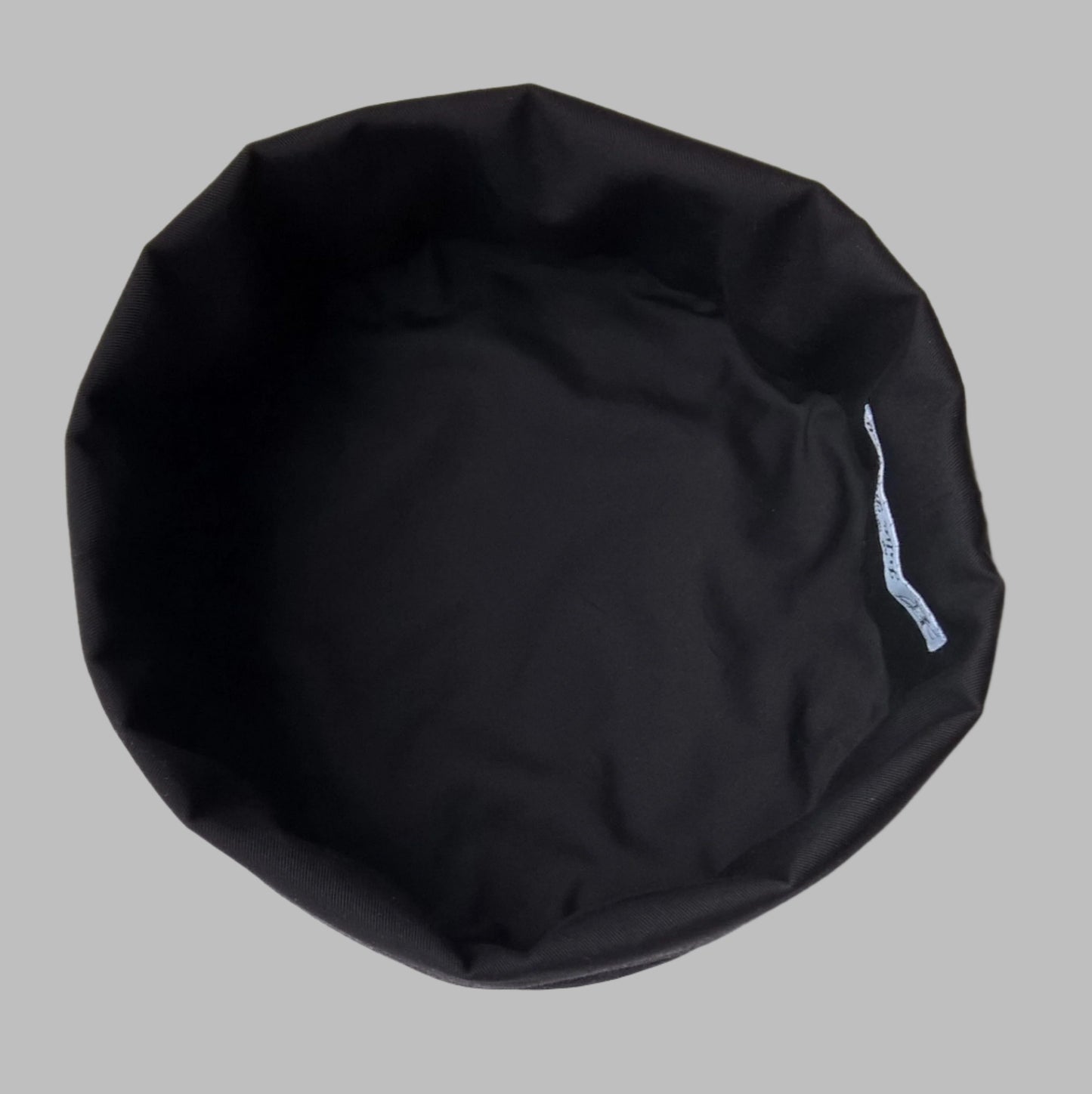 The hat has a black fine cotton lining