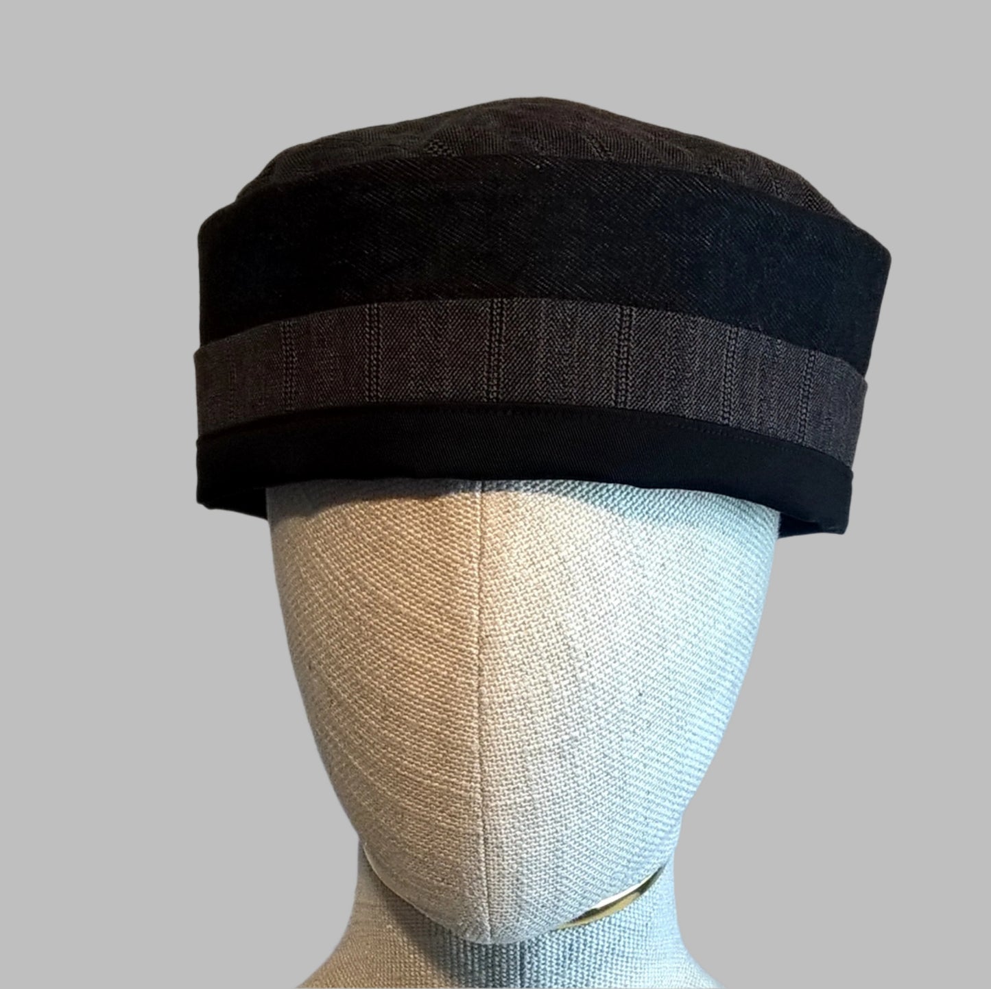 Black brimless pillbox cap handmade for warmer months in breathable fabrics of wool cashmere blend, cotton denim and cotton twill