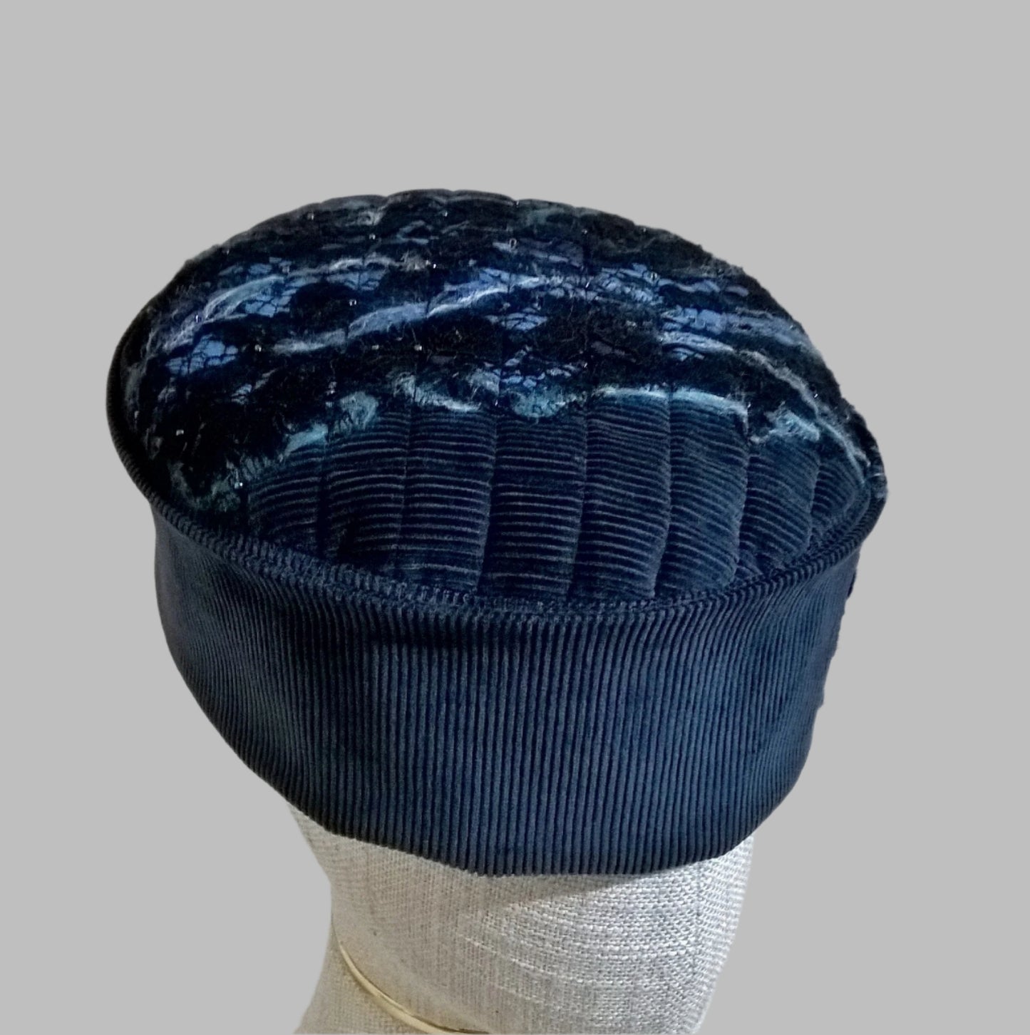 Pillbox style hat with nuno felting embellishment 