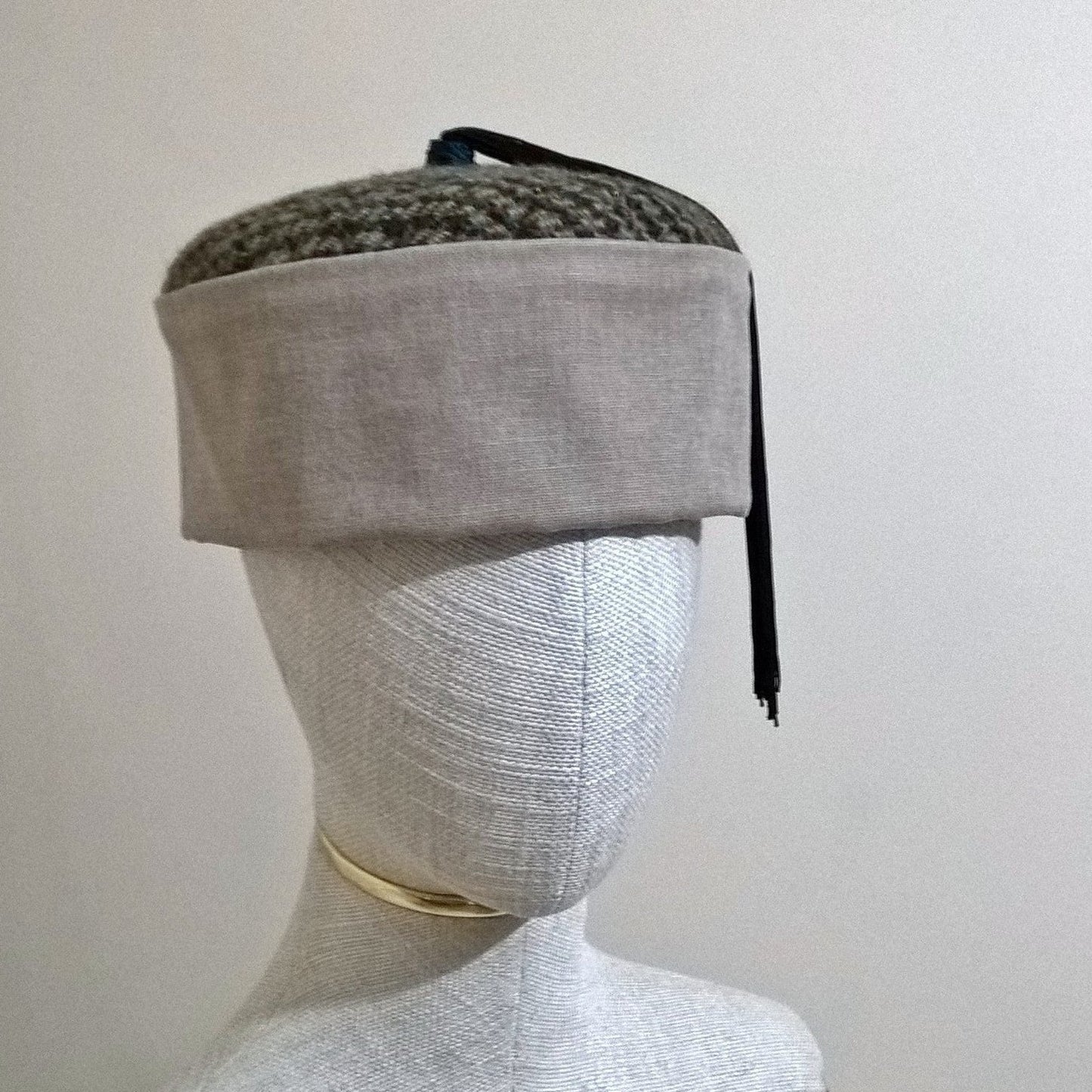 Brown and beige Harris Tweed Smoking Cap with blue and black tassel