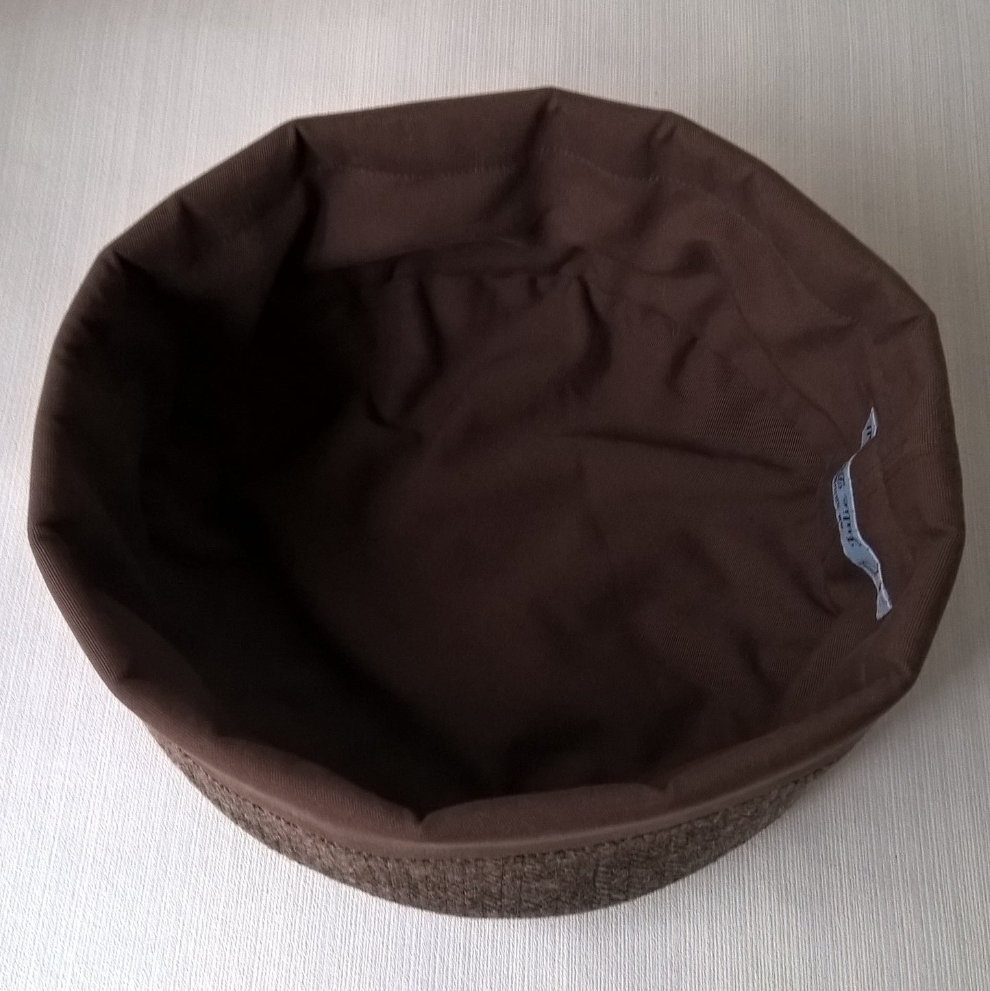 Cotton lining of brown herringbone wool hat