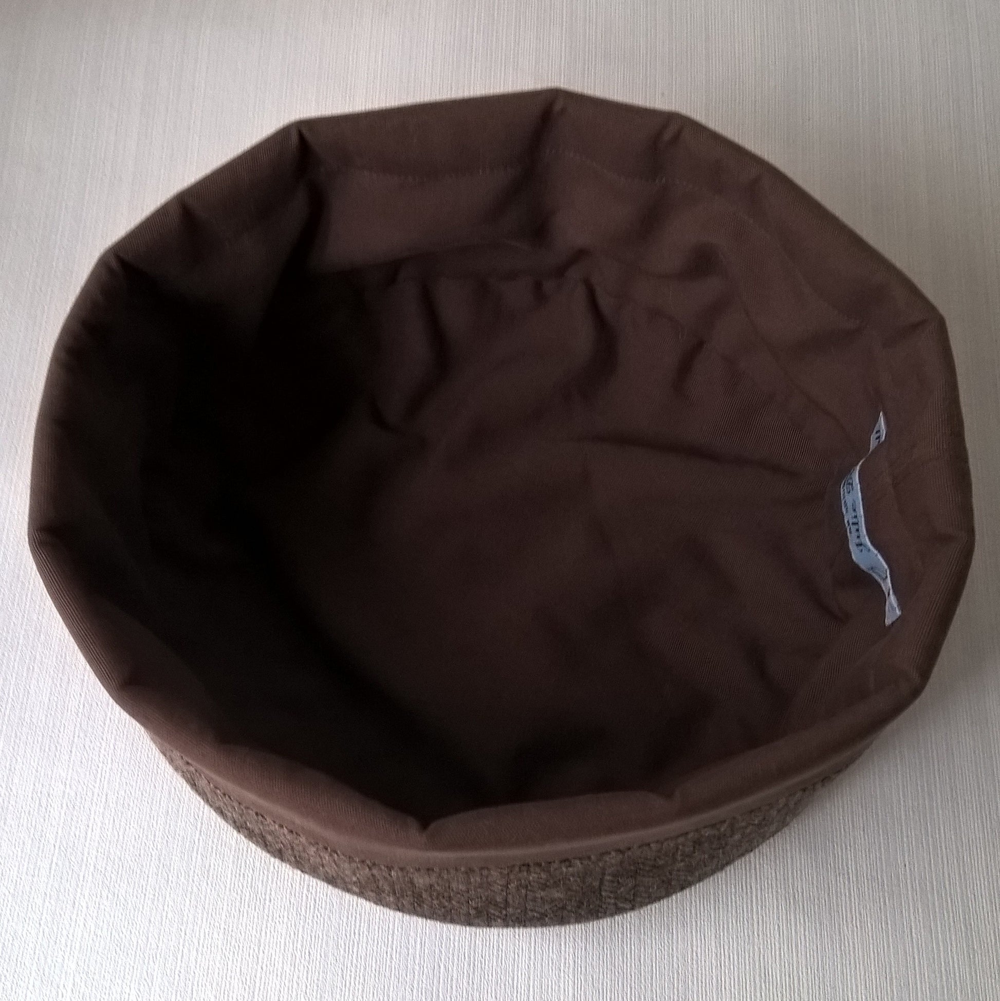 Cotton lining of brown herringbone wool hat
