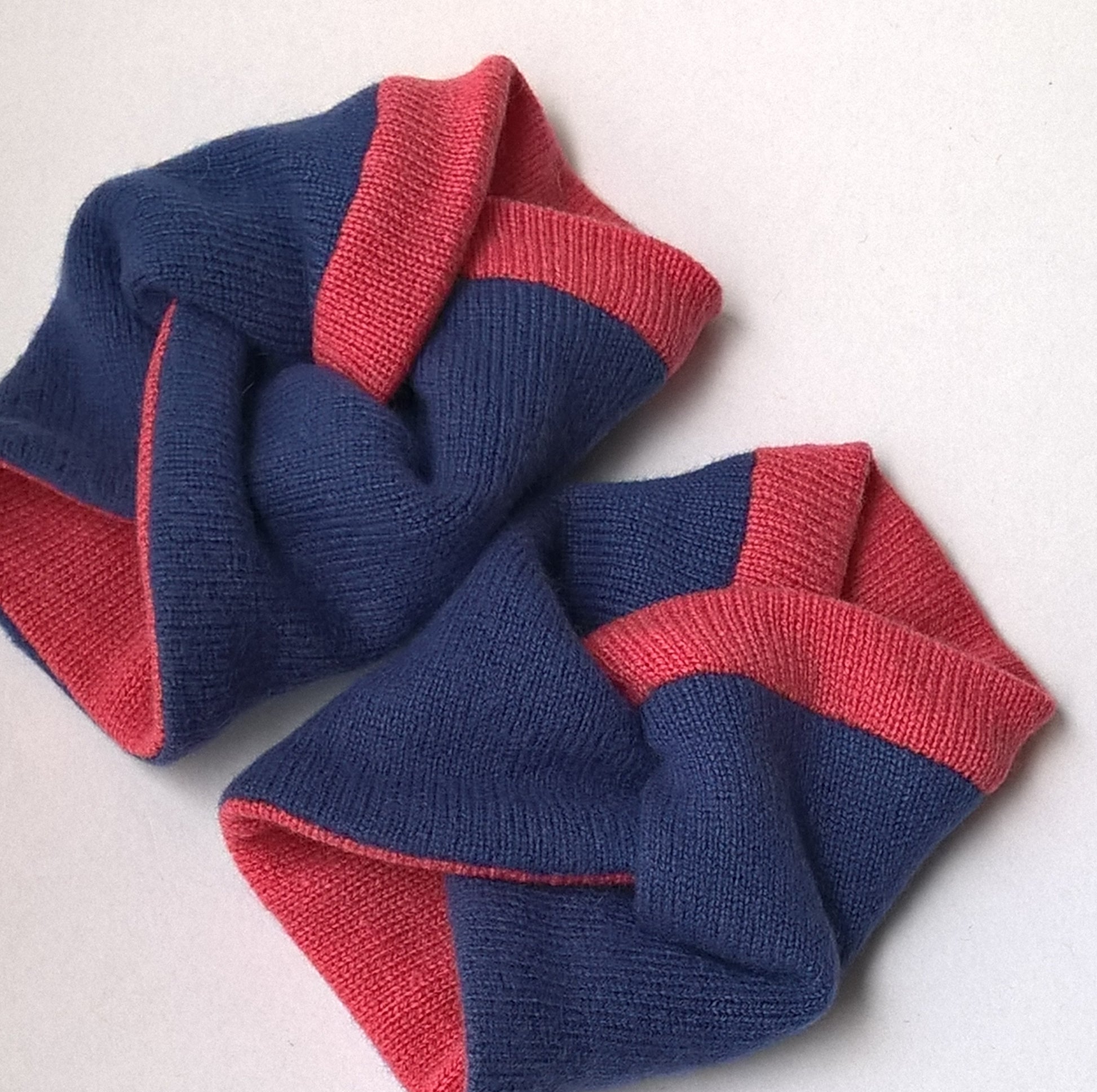 Winter pulse warmer cuffs handmade from upcycled sweaters in deep blue and vibrant pink