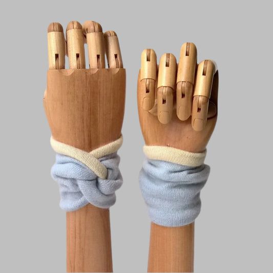 Pure Cashmere wrist warmer cuffs handmade in pale blue with cream edging and lining.