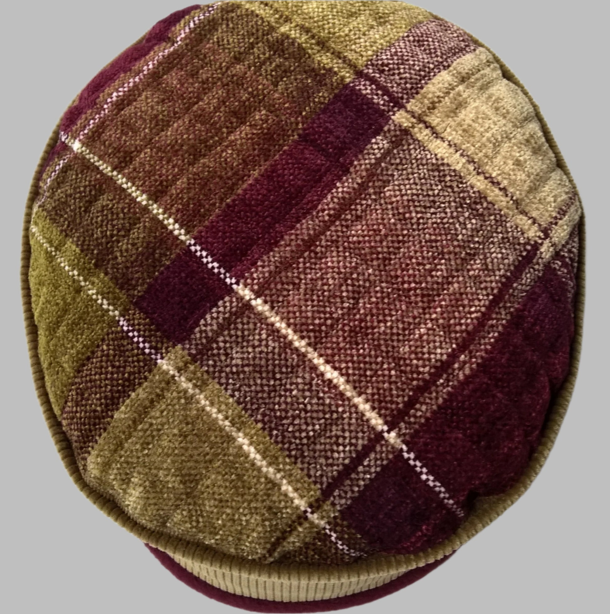 Tip of hat in olive green and burgundy check patterned chenille 