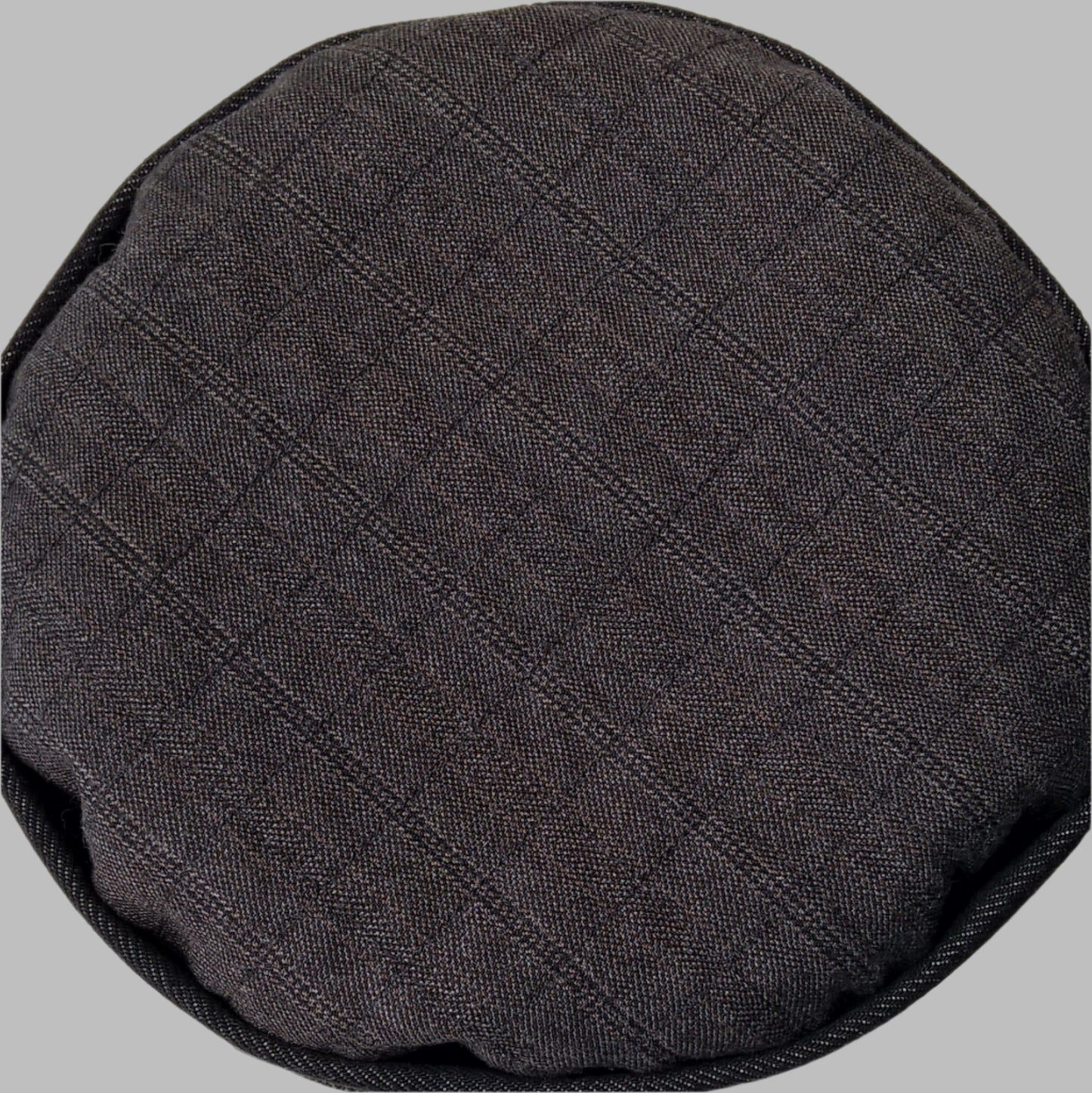 Close up view of the tip as the pinstripe wool cashmere fabric is quilted to fine bamboo cotton wadding and shrunk to give a slightly puffy antique quilt look