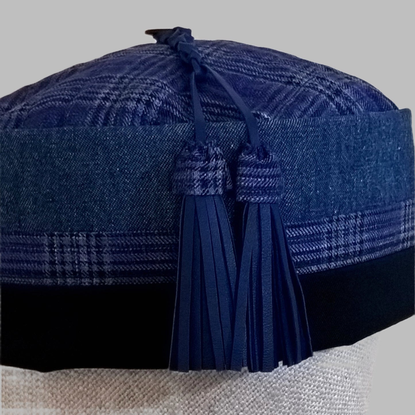 Cobalt blue macrame leather tassel trimmed with fine wool check fabric