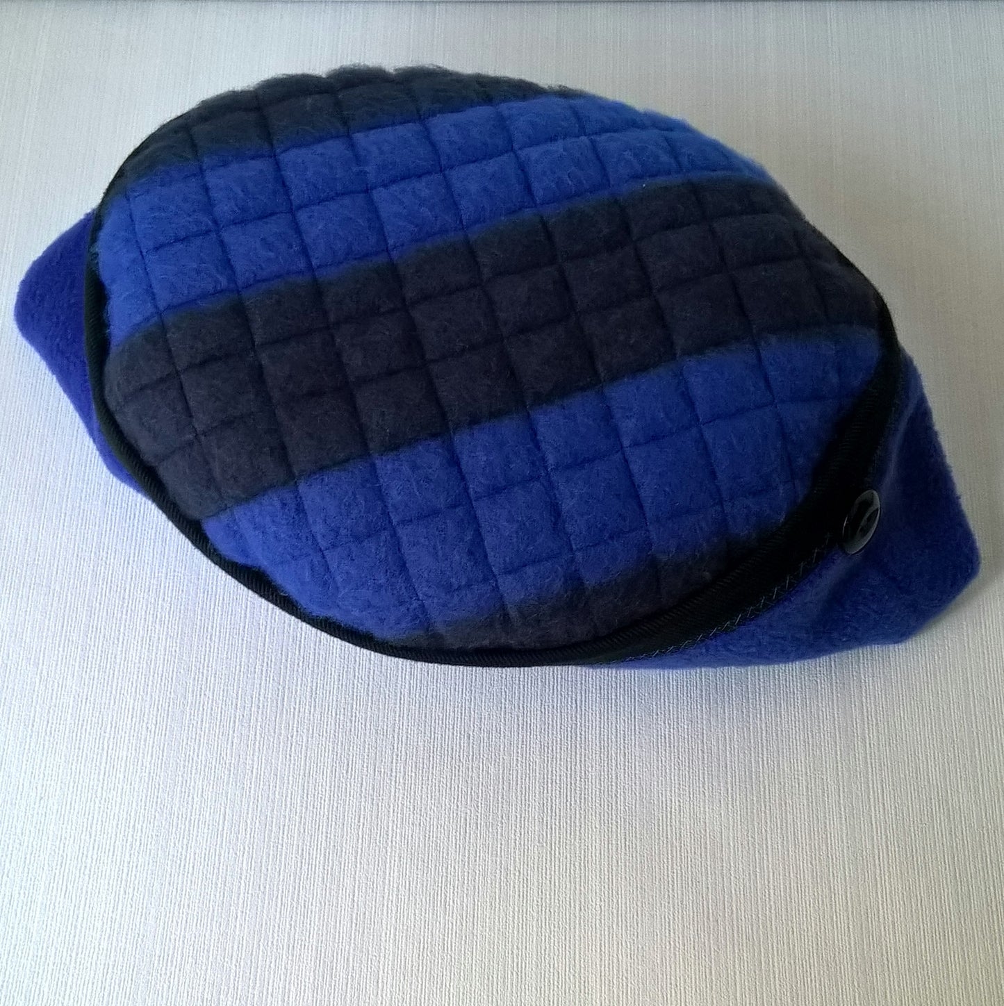 The striped fleece tip is quilted