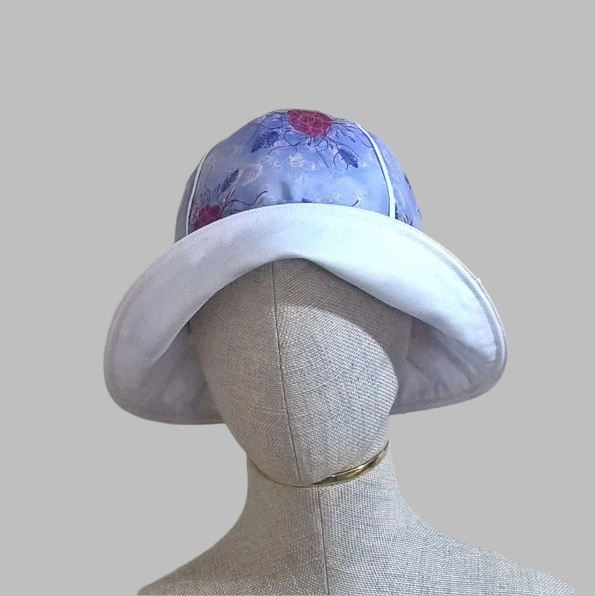 Front of brim turned up on the raspberry bucket hat