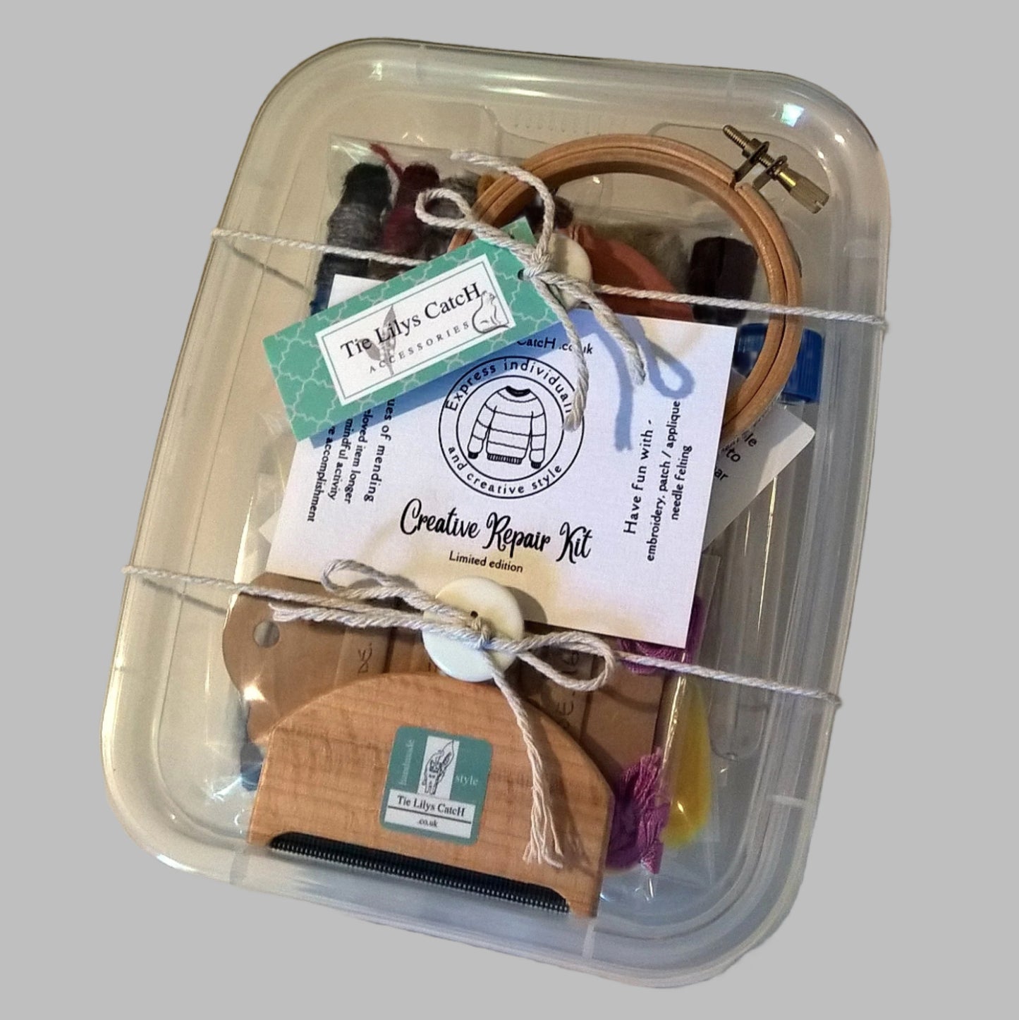 Creative knitwear repair kit packaged in clear re-usable plastic box