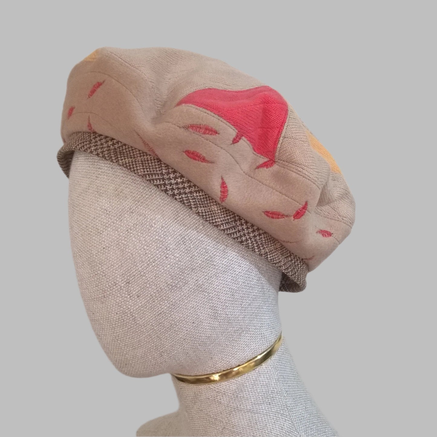 Handmade beret combining upcycled cashmere sweaters and coat.