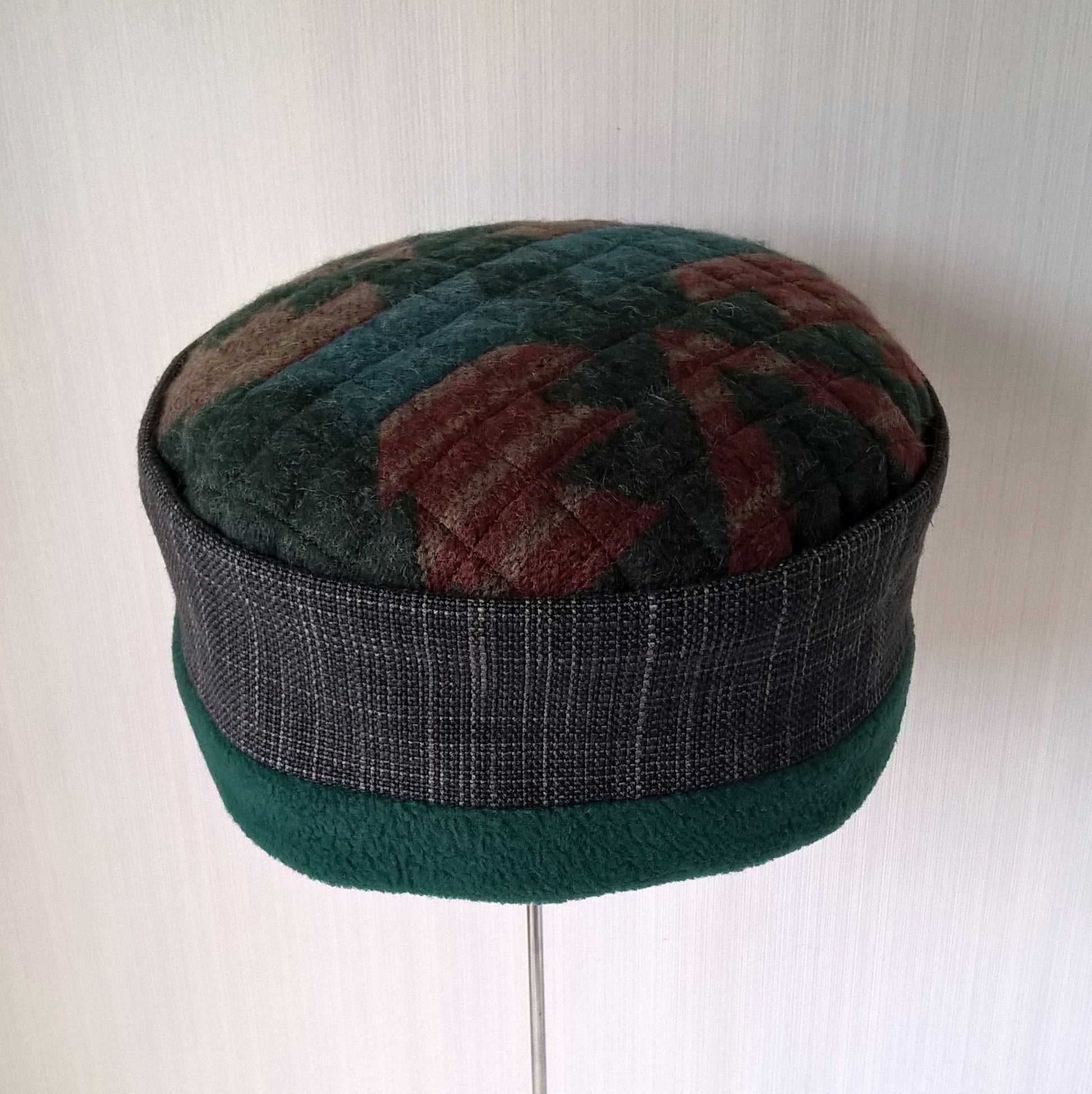 Brimless cap in Aztec design with forest green fleece lining