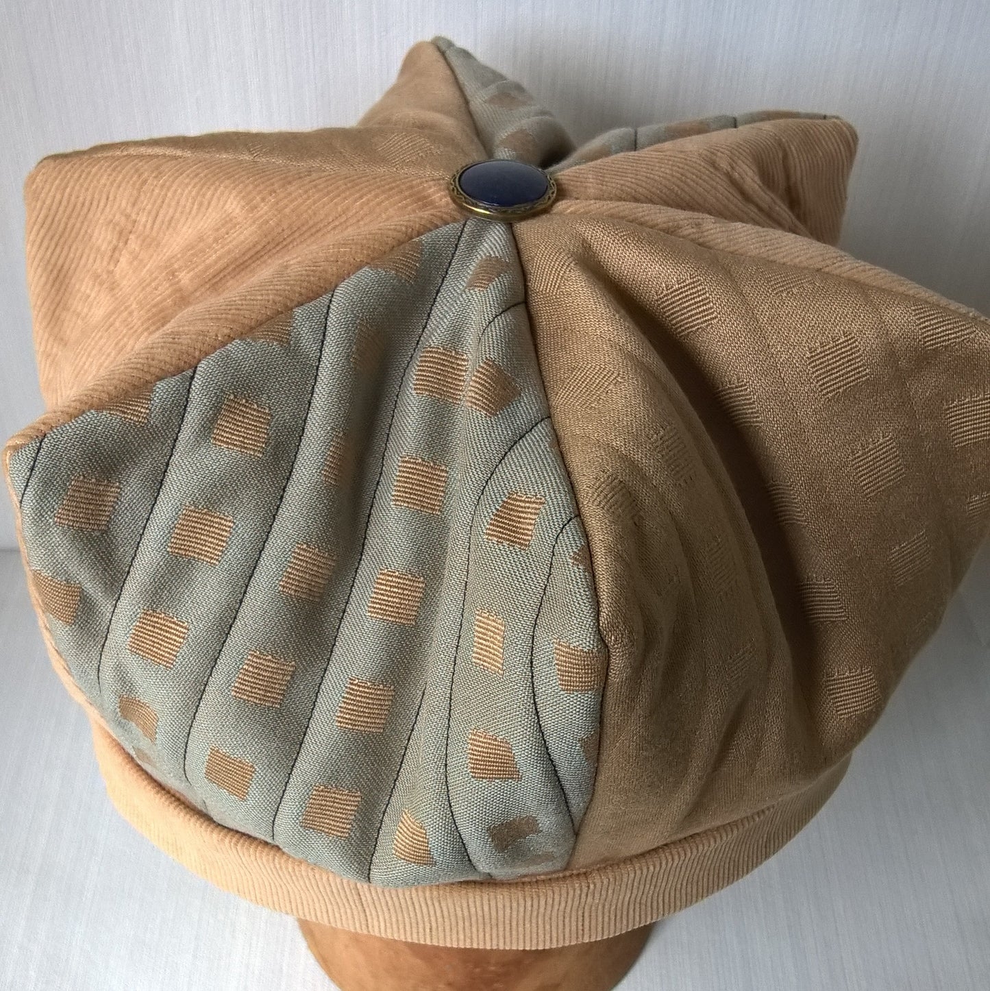 Gold panels have been quilted with  matching thread, while blue panels have been quilted with navy thread.