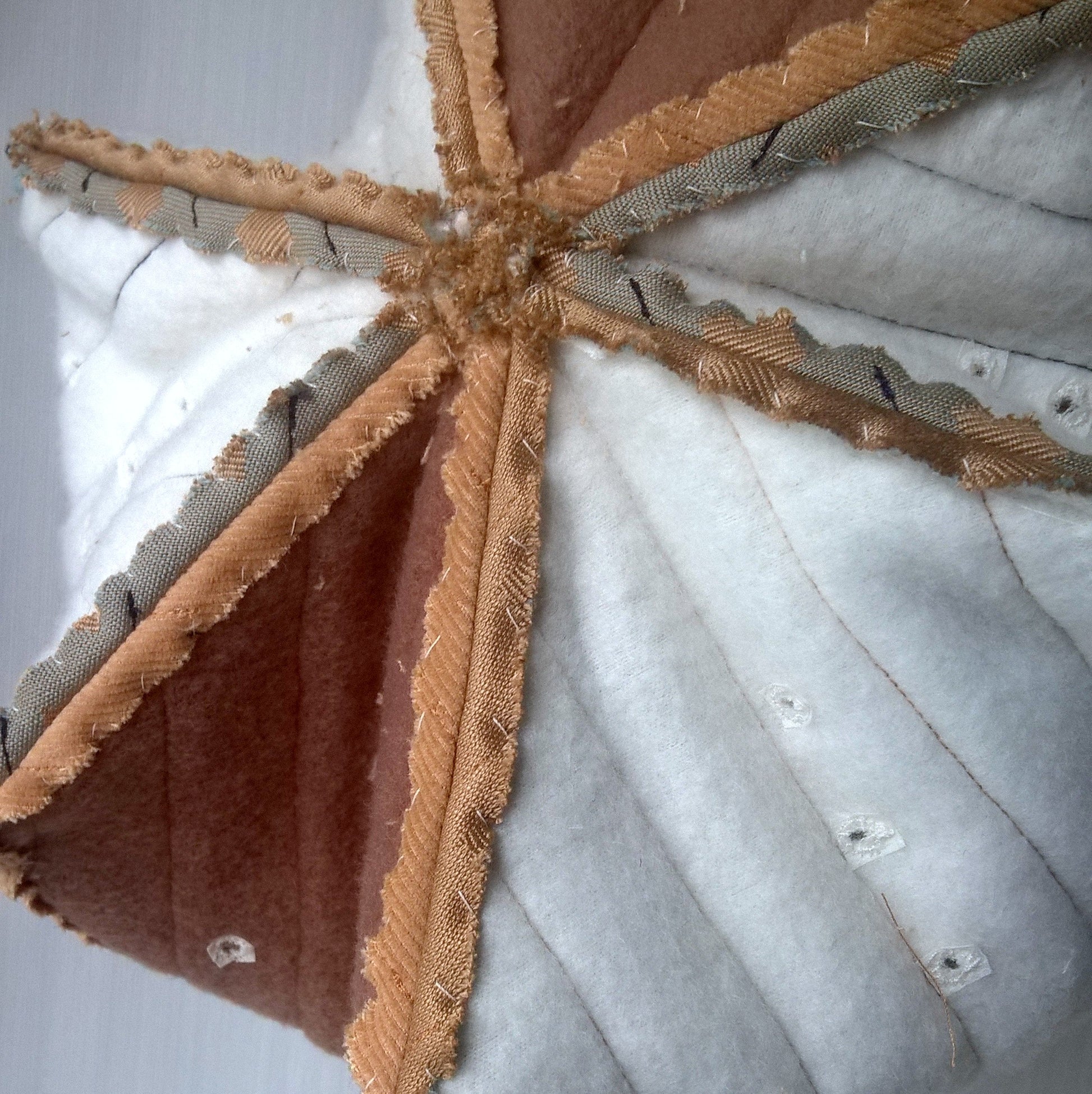 Each panel has been individually quilted with fleece and the seams hand-stitched flat. Air eyelets have been stitched into the fleece.