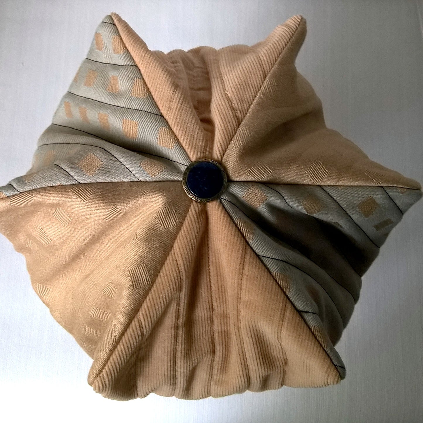 The harlequin smoking cap has a six point tip shaped like a crown