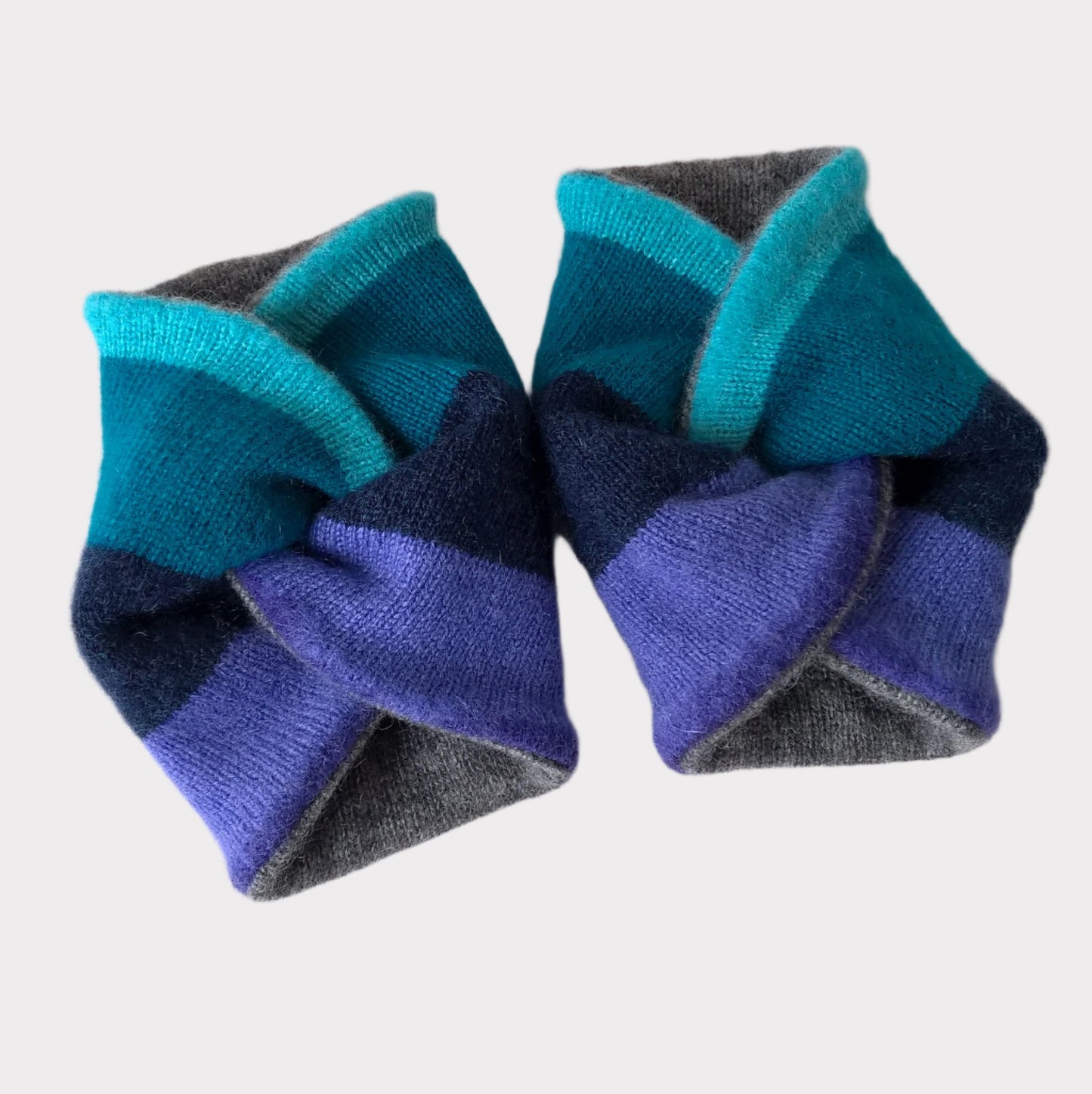 Cashmere wrist warmers in a twisted knot design
