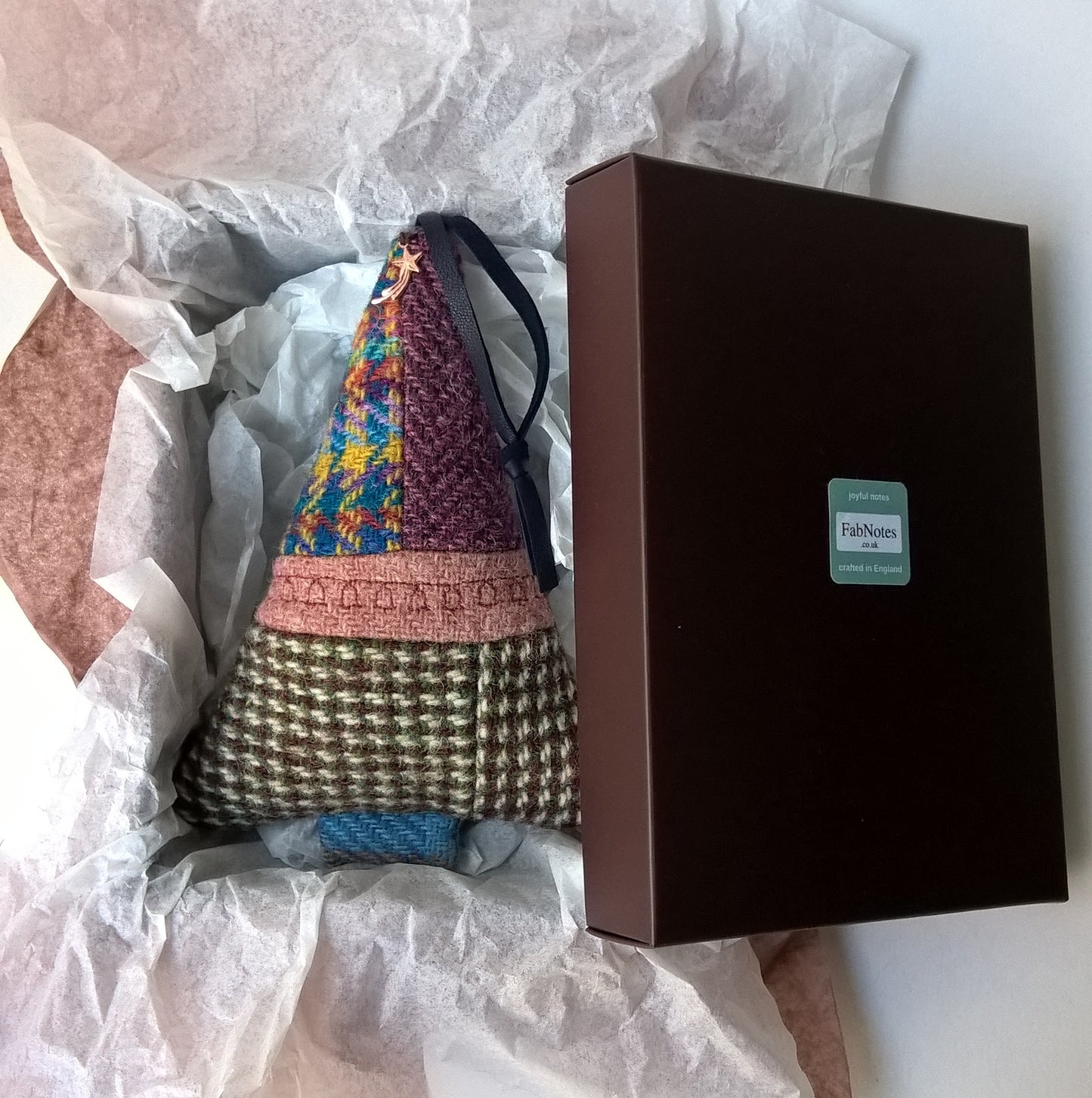 The Harris Tweed ornament is boxed ready for giving