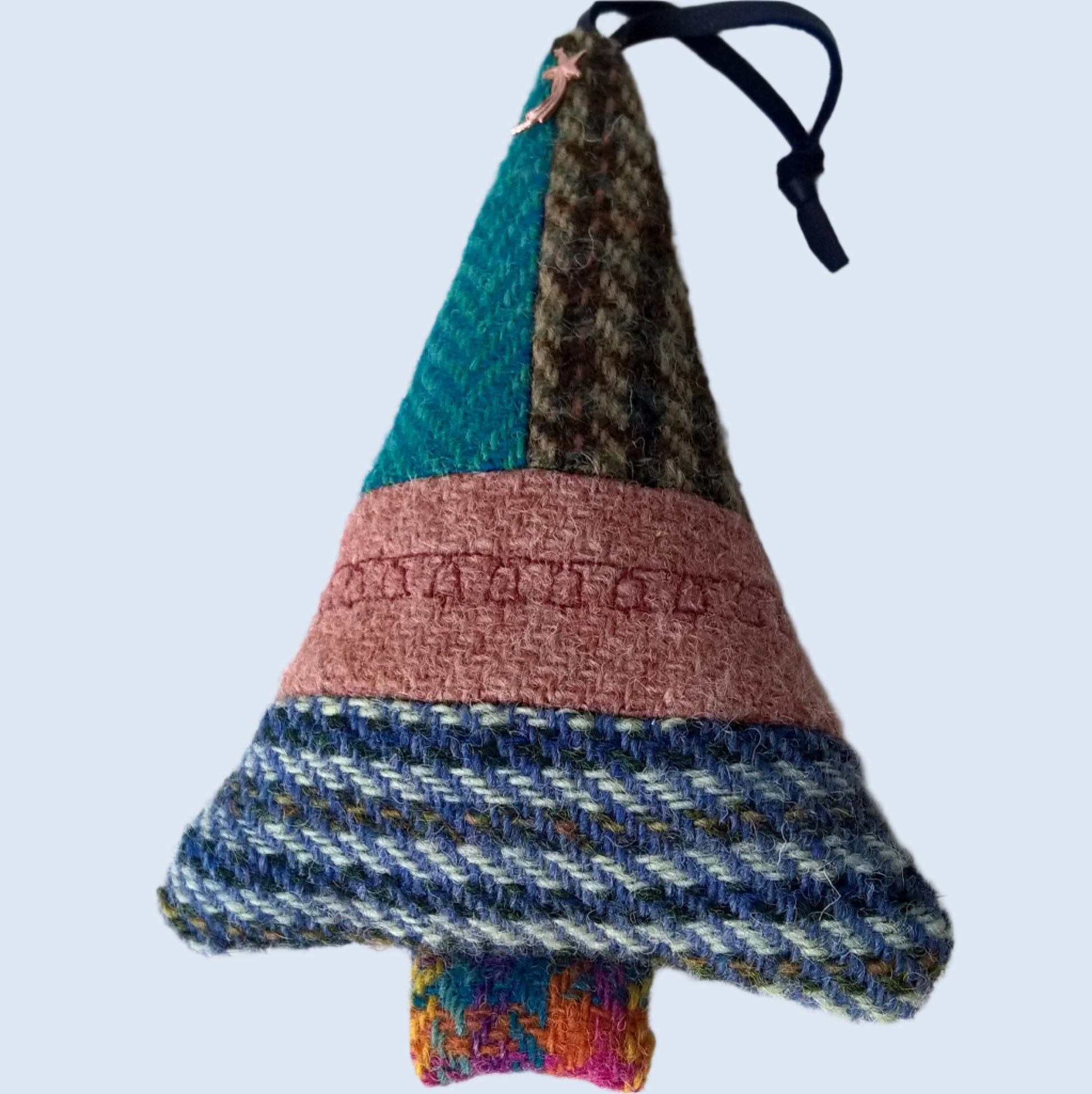 Five Harris Tweed fabrics make up the front of this hanging Christmas tree ornament  which is 100% wool