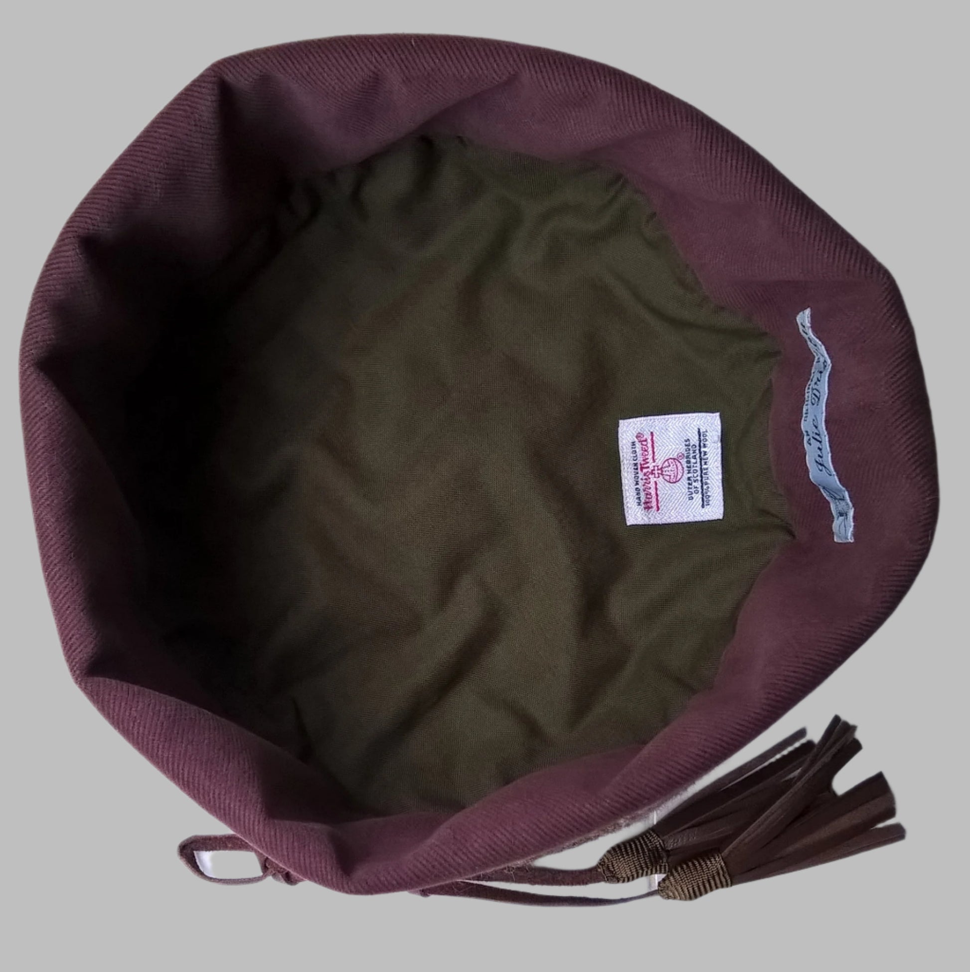 Harris tweed hat is lined in green cotton