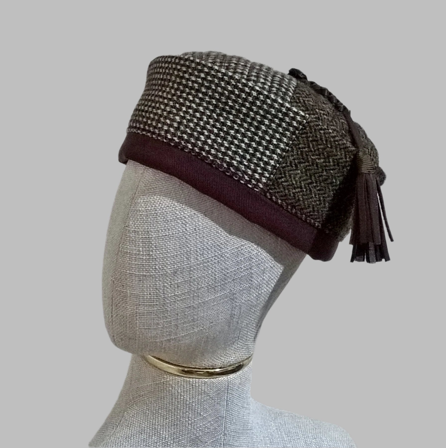 Mismatched Harris Tweed wool smoking cap  in patchwork design with leather tassel