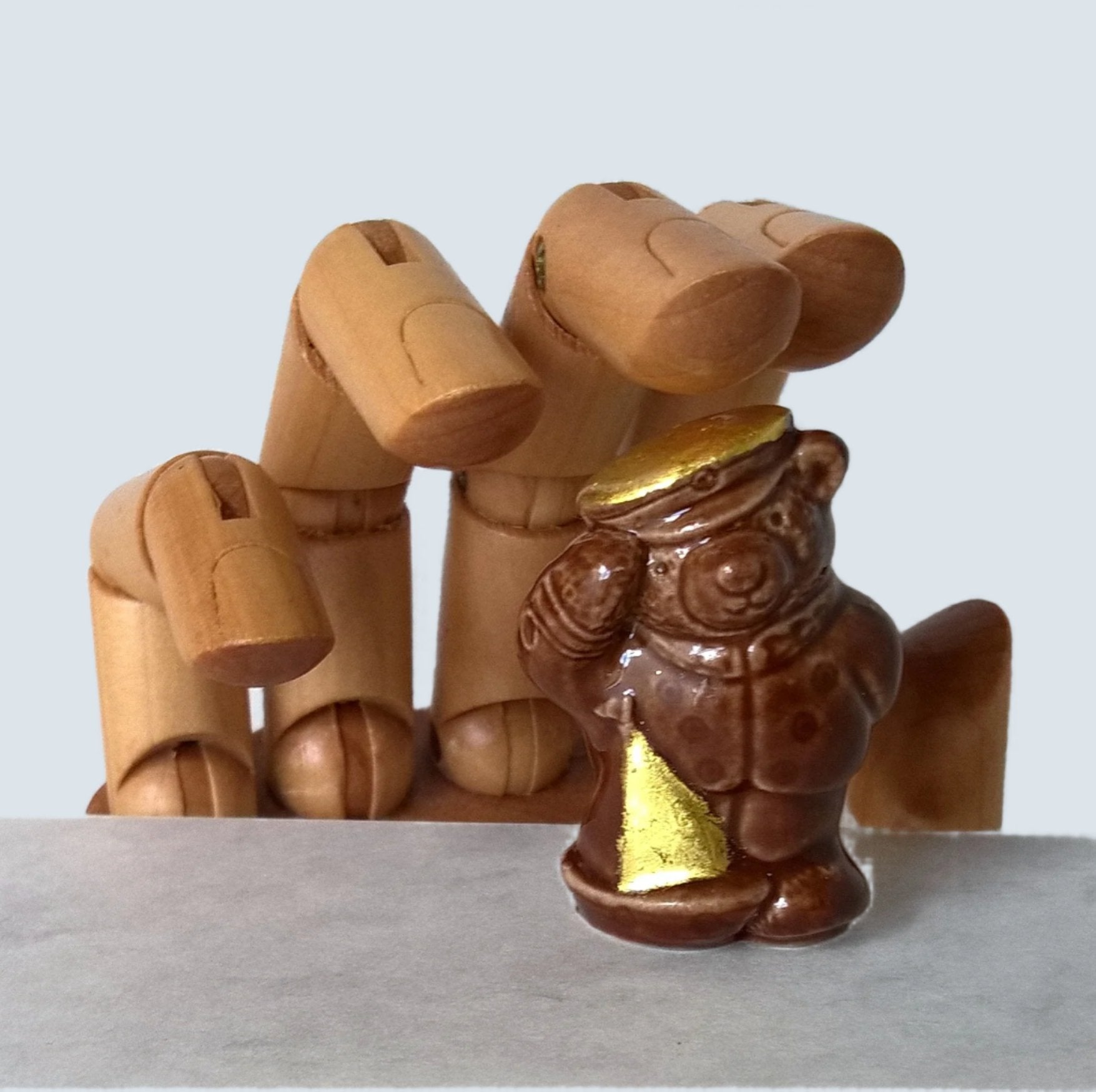 Little brown ceramic sailor bear with toy boat gilded with pure gold leaf