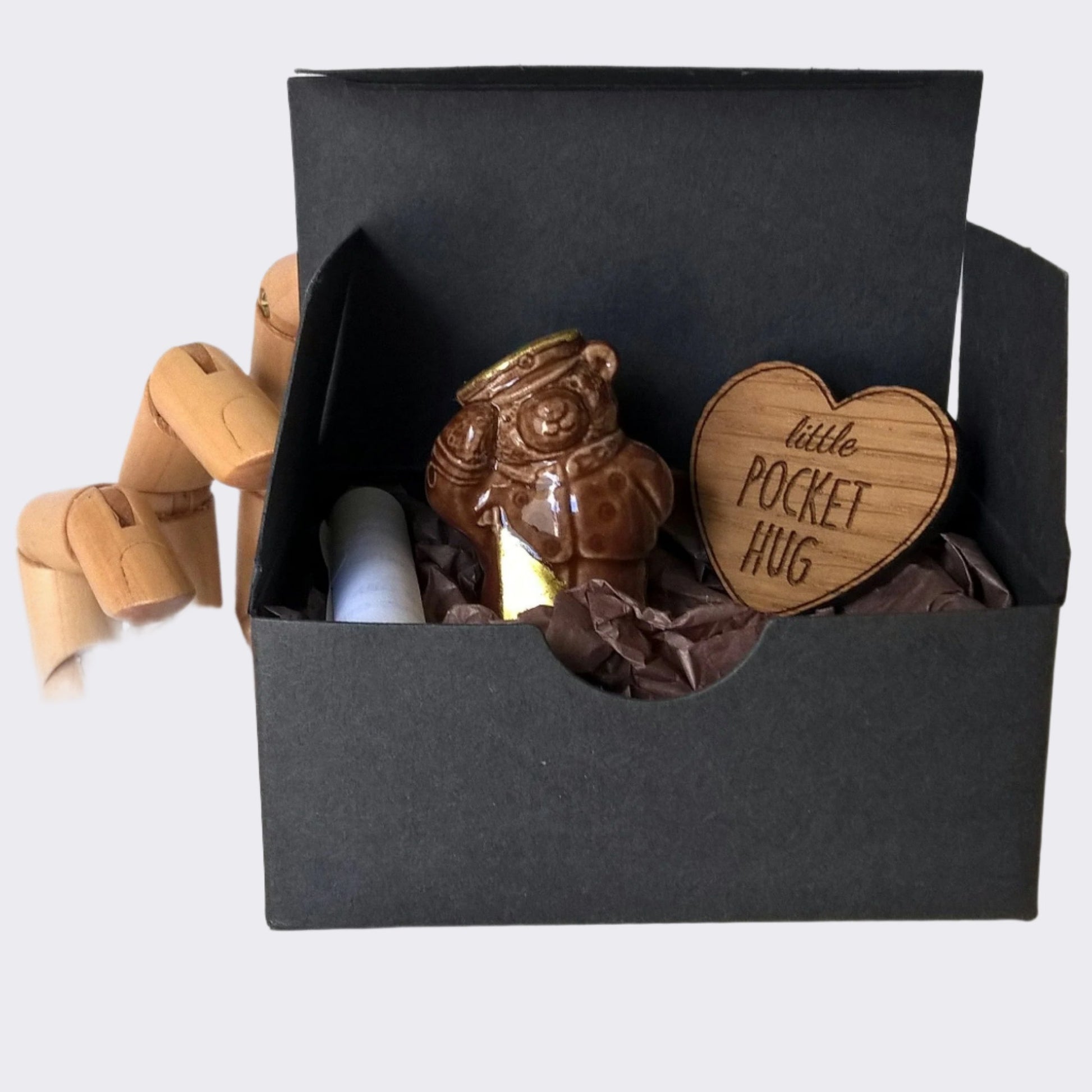 The miniature vintage bear and engraved heart are boxed ready for gifting
