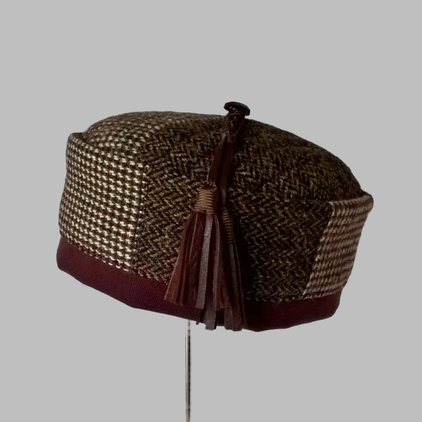 Mismatched Harris Tweed smoking cap with macrame leather tassel