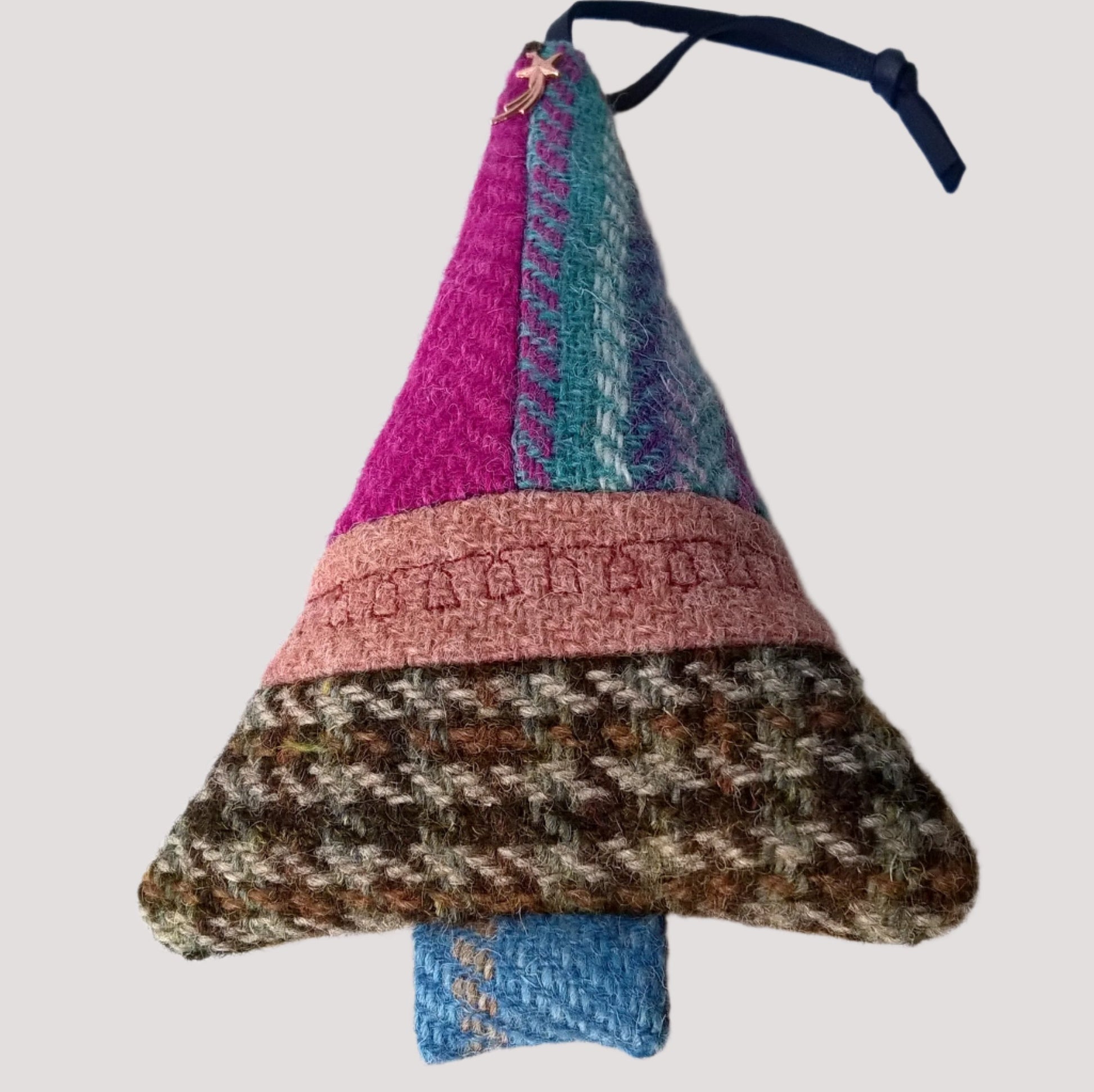 Tree ornament is multi coloured Harris Tweed with machine embroidered bells along the centre