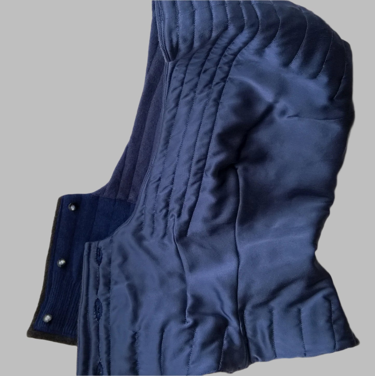 Hood is fully lined with blue silk which is part quilted to the cashmere