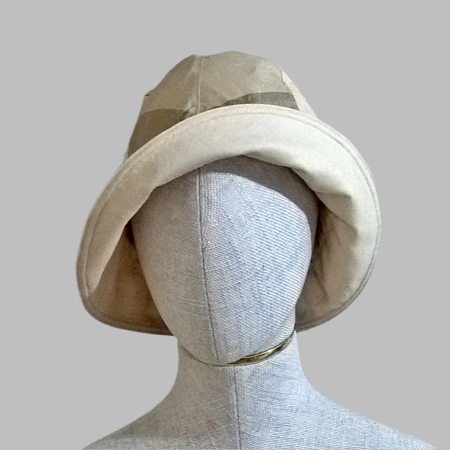 Raw silk bucket hat with millinery reed edge so the brim can be worn turned up. 