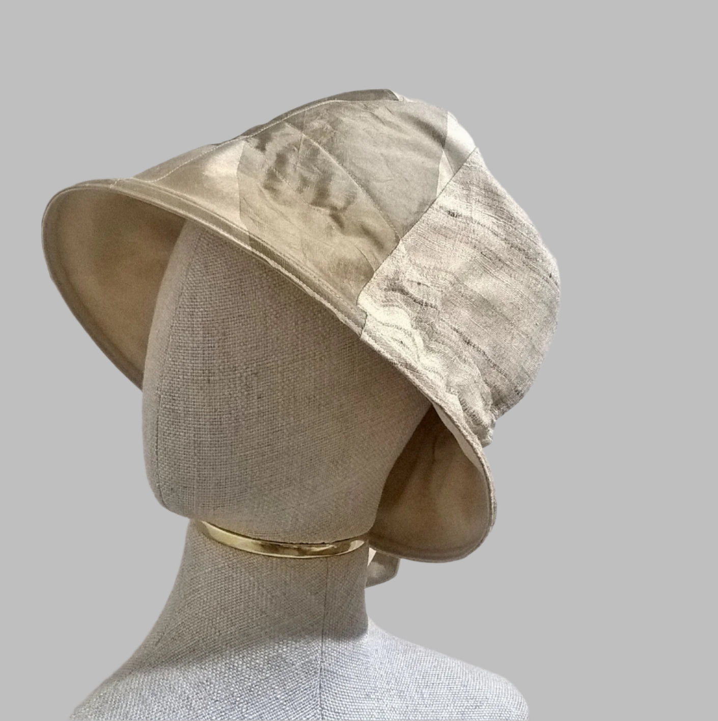 Silk bucket hat in neutral tones of beige taupe and gold