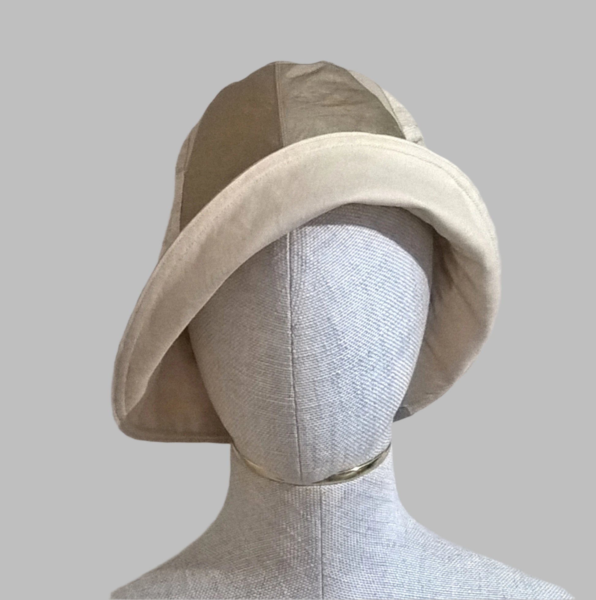 One side of brim rolled up and silk bucket hat to give a different look