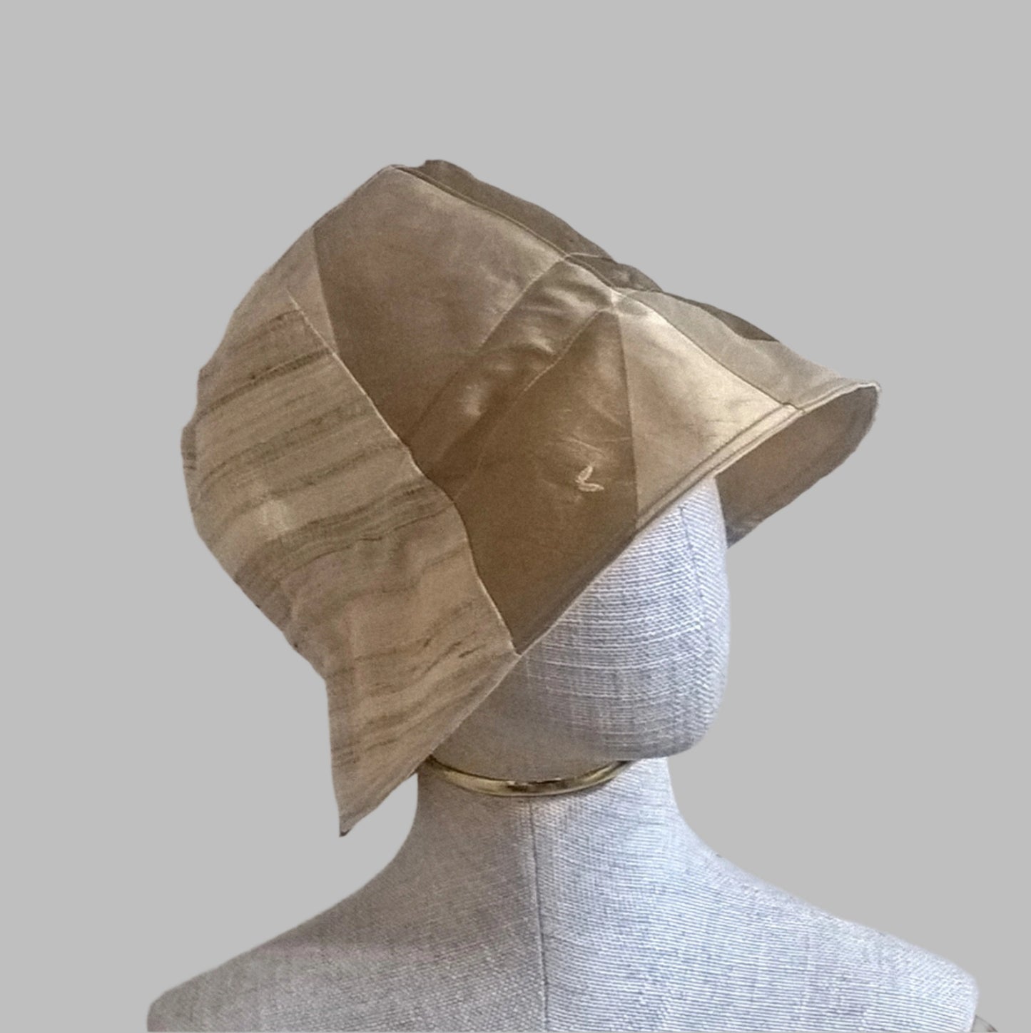 Side view of bell shaped silk bucket hat