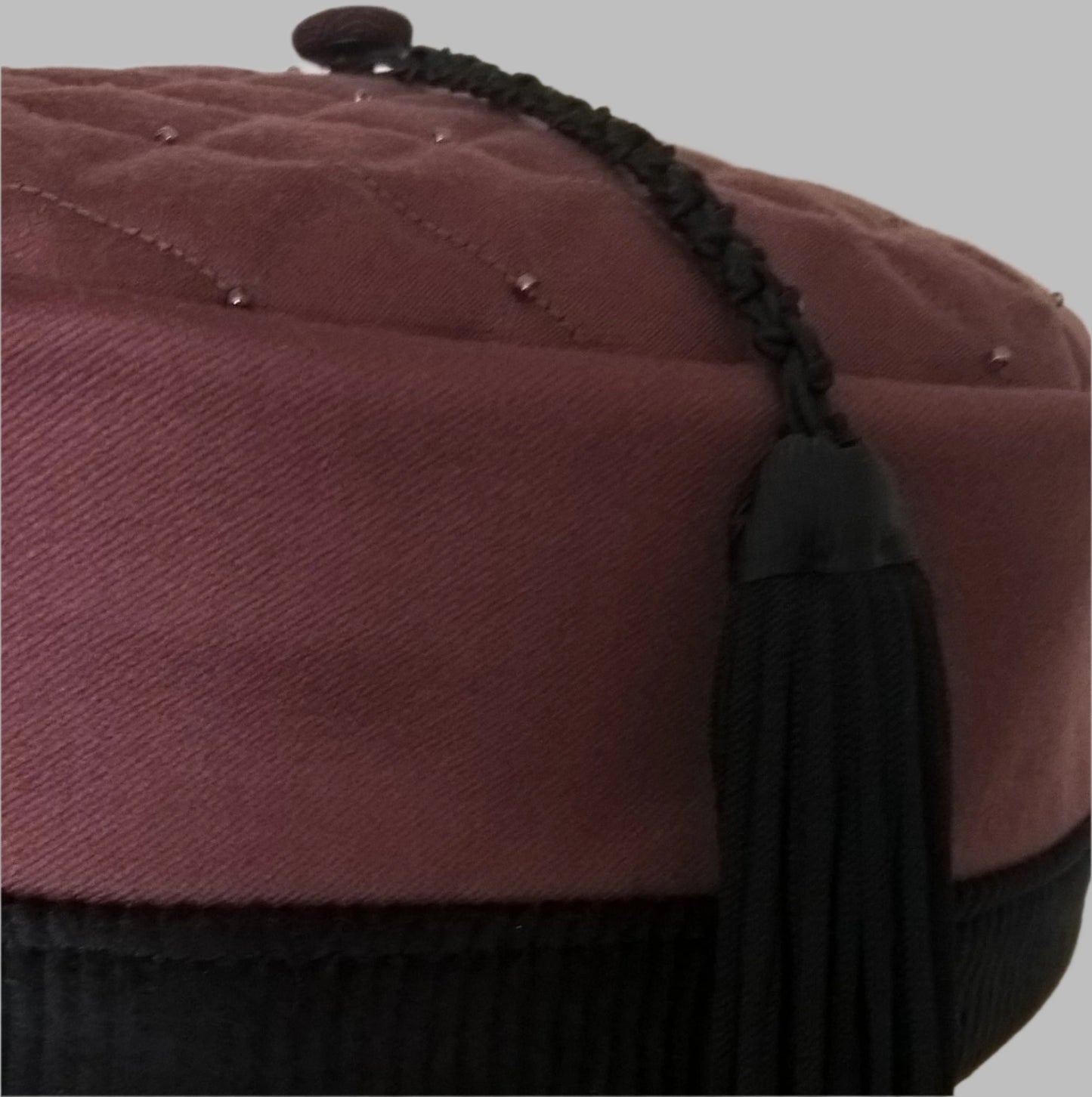 The macrame tassel is handcrafted using vintage fringing, satin braid  and grosgrain ribbon