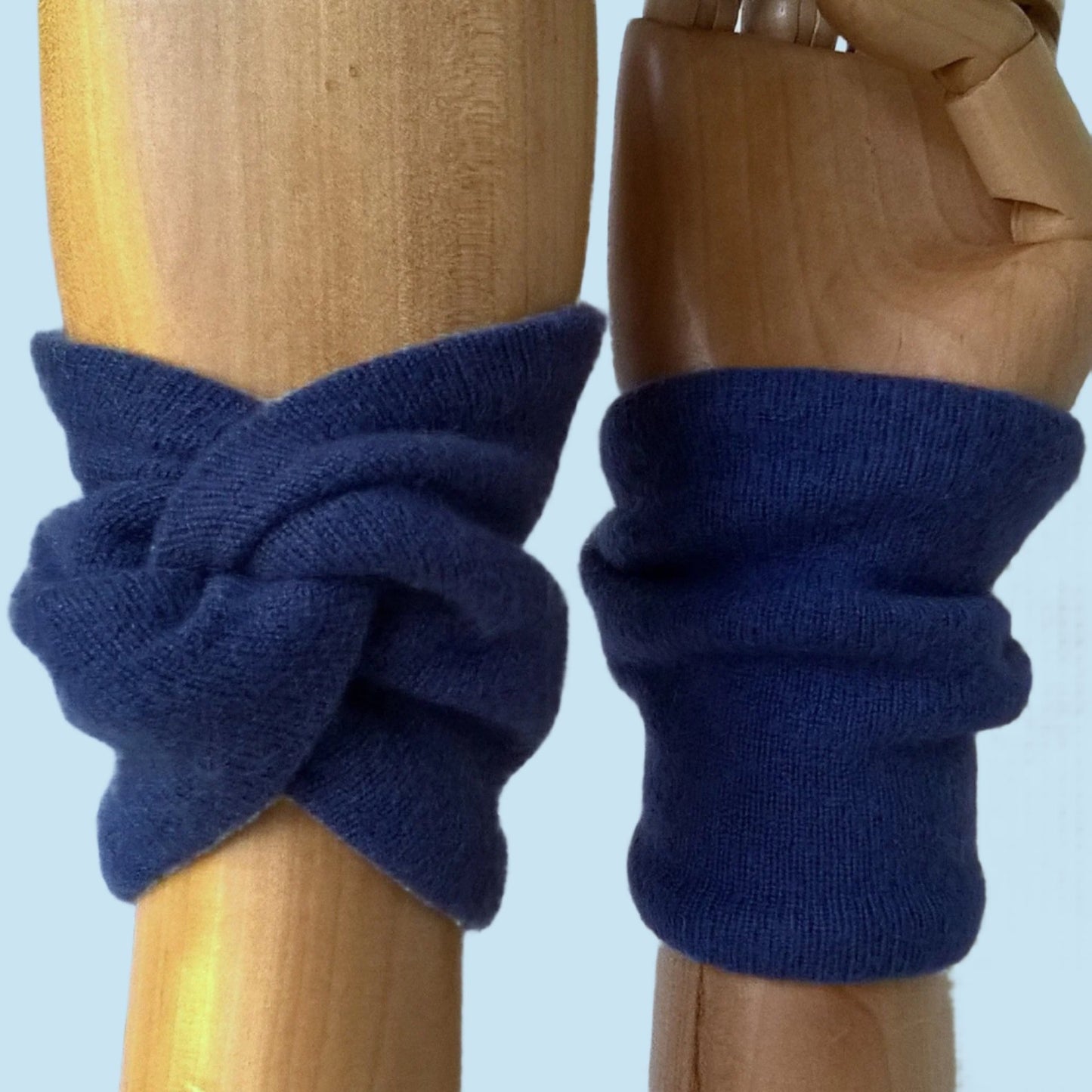 Spruce blue cashmere wrist warmers in a knot design