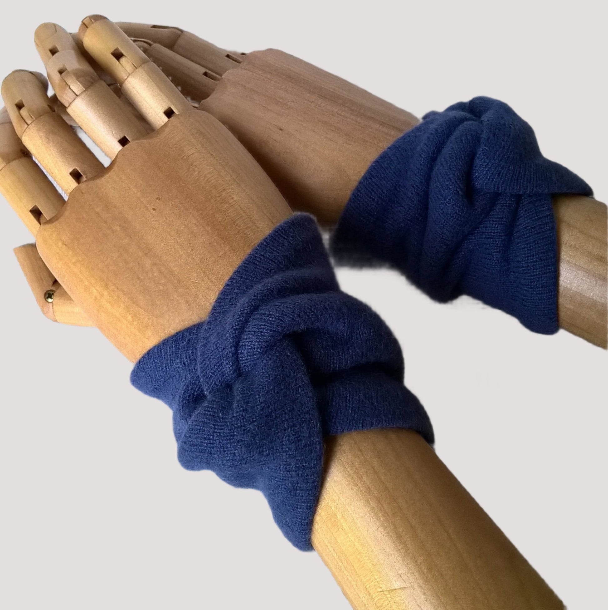 Handmade cashmere wrist warmers cover the pulse points to raise body temperature, leaving the hands free for performing tasks