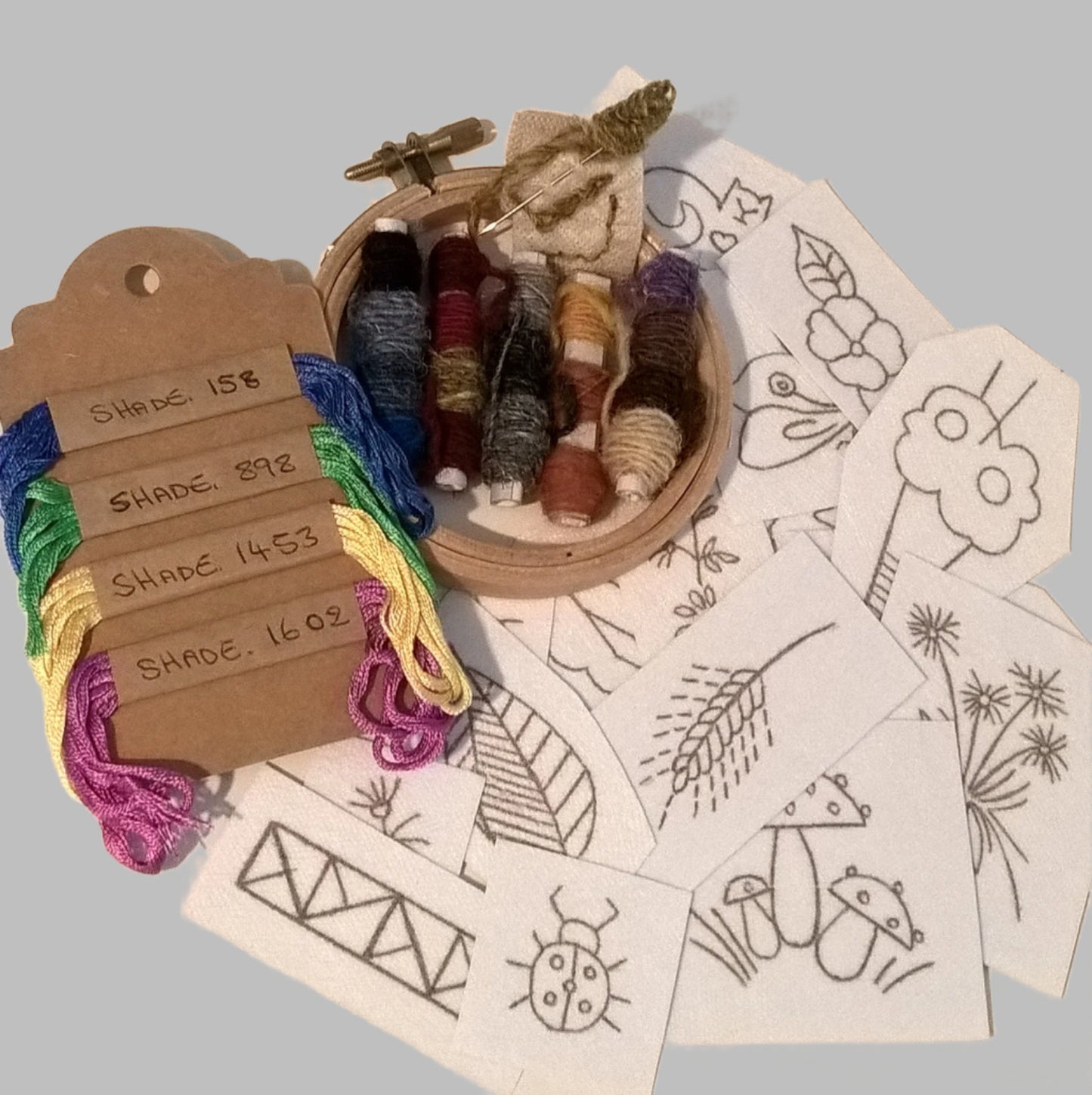 The repair kit has an embroidery hoop, stick and stitch patch embroidery designs with Harris Tweed wool thread and pure silk vintage thread