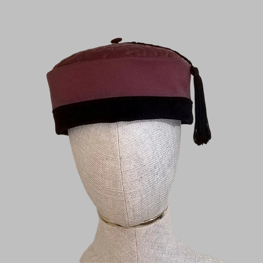 Maroon and black smoking cap with quilted and beaded tip and macrame tassel