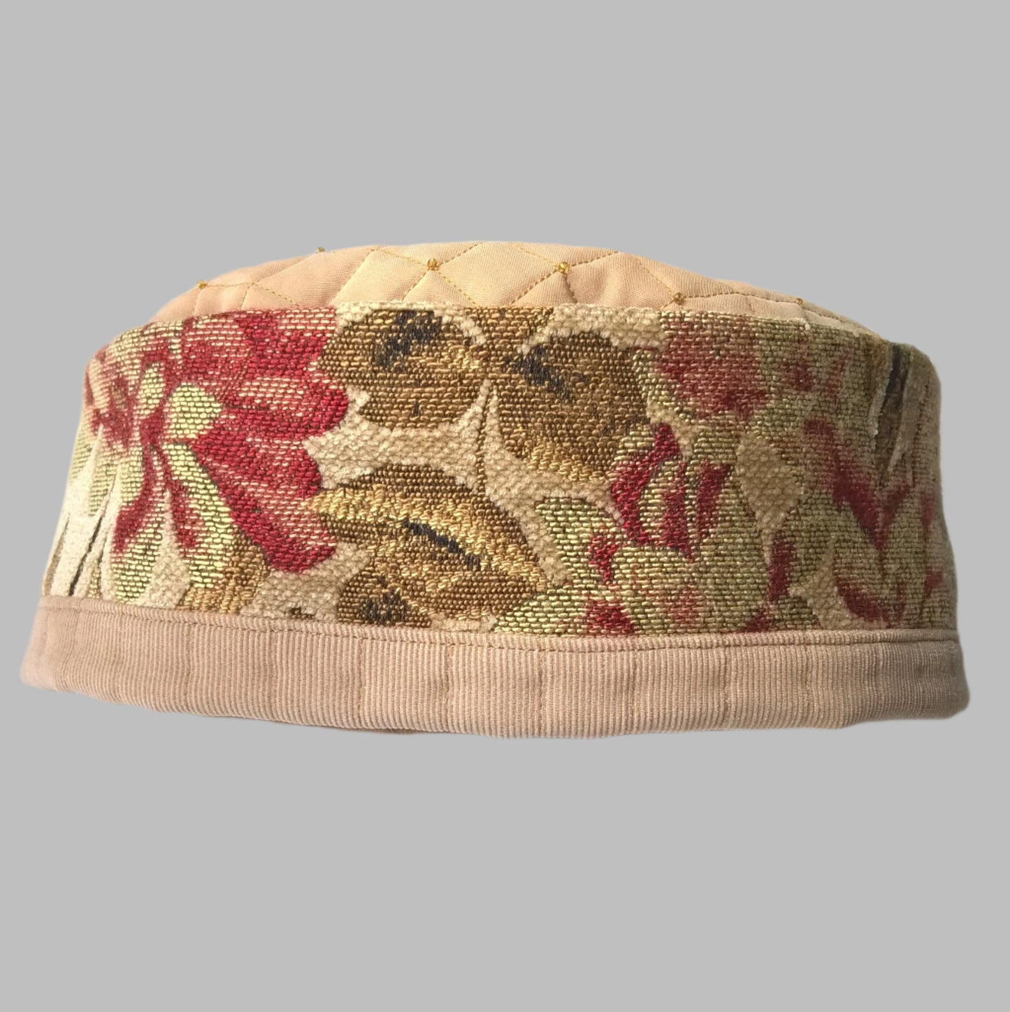 Tapestry brimless indoor hat embellished with beading and quilted for warmth. 