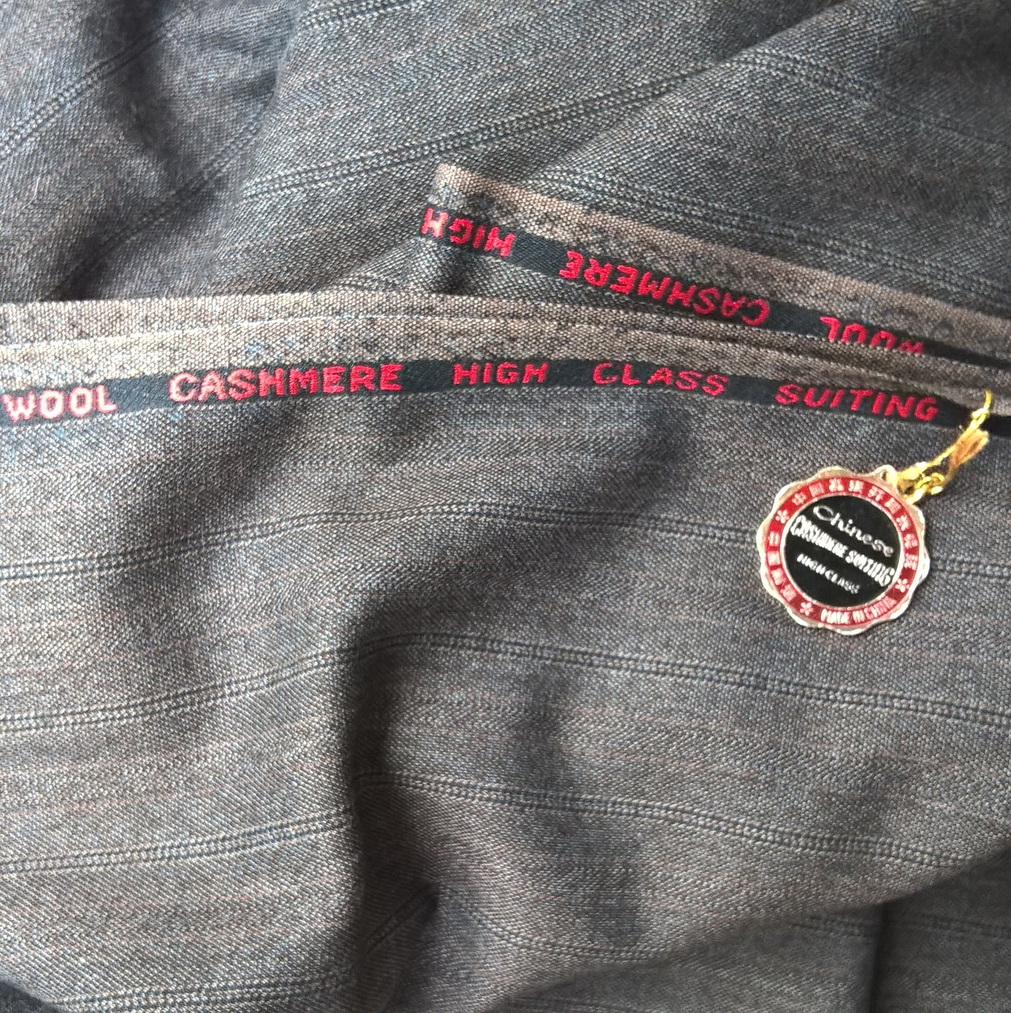 Vintage wool cashmere pinstripe fabric used to make the black brimless warmer weather cap