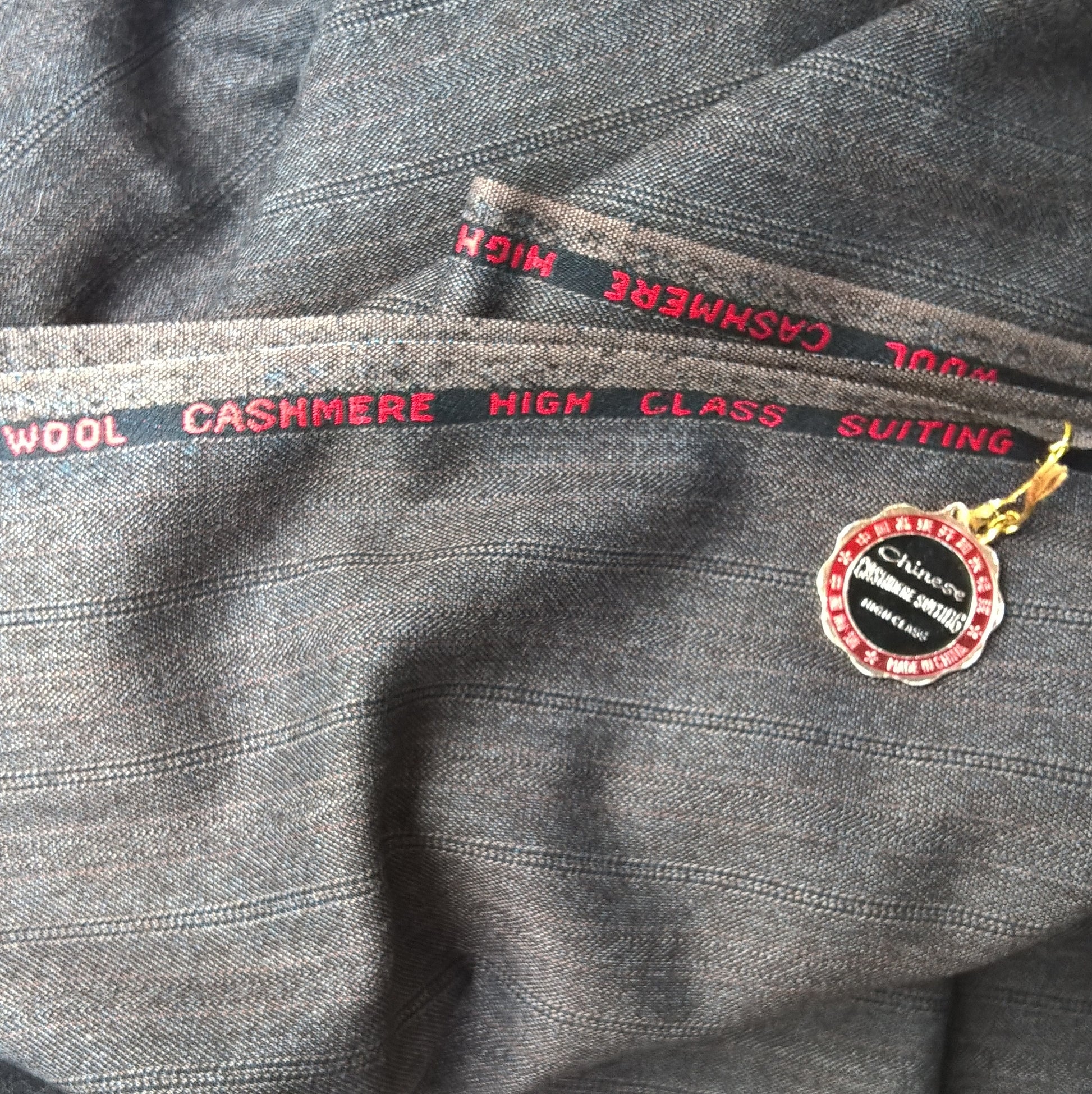 Vintage wool cashmere pinstripe fabric used to make the black brimless warmer weather cap