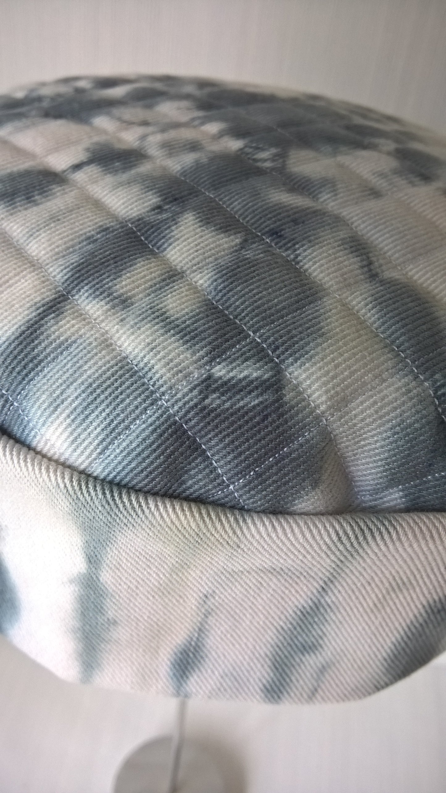 Textured cotton twill fabric with tie dye detail on white and black cap